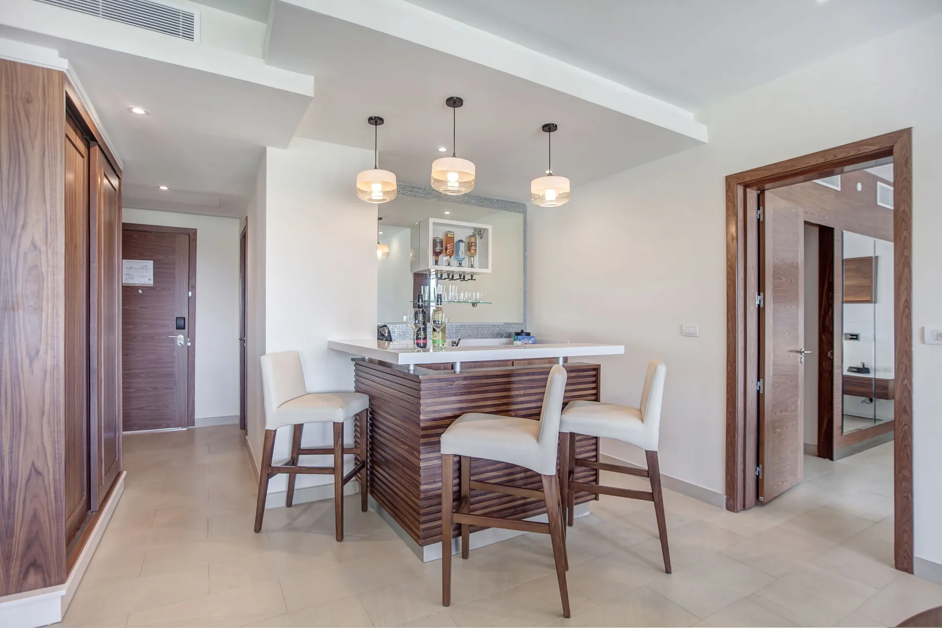 Wet bar and entry area in a Luxury Presidential One Bedroom Ocean View suite at Royalton Negril.
