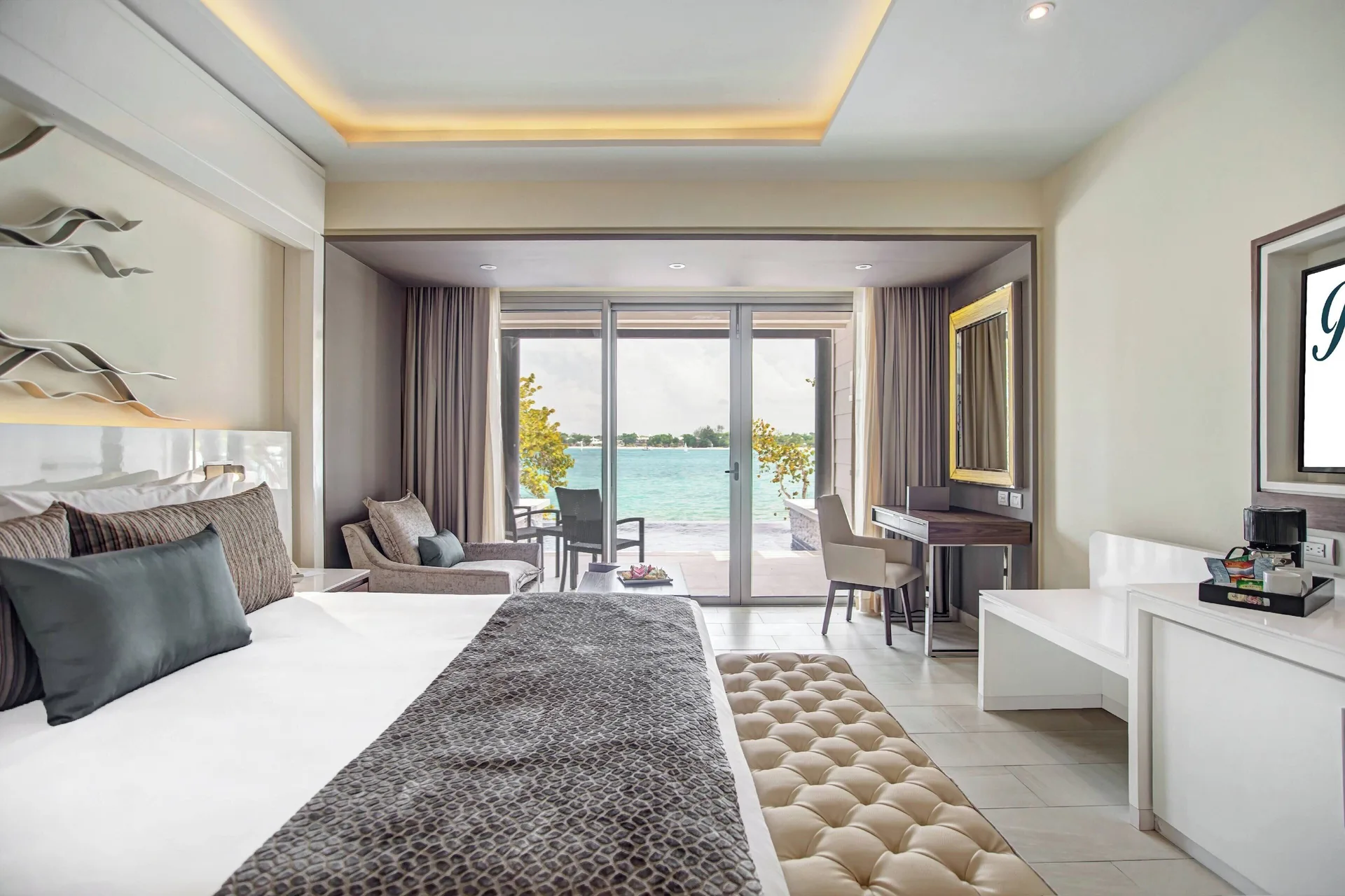 Ocean view bedroom with king bed and balcony at Royalton Negril.