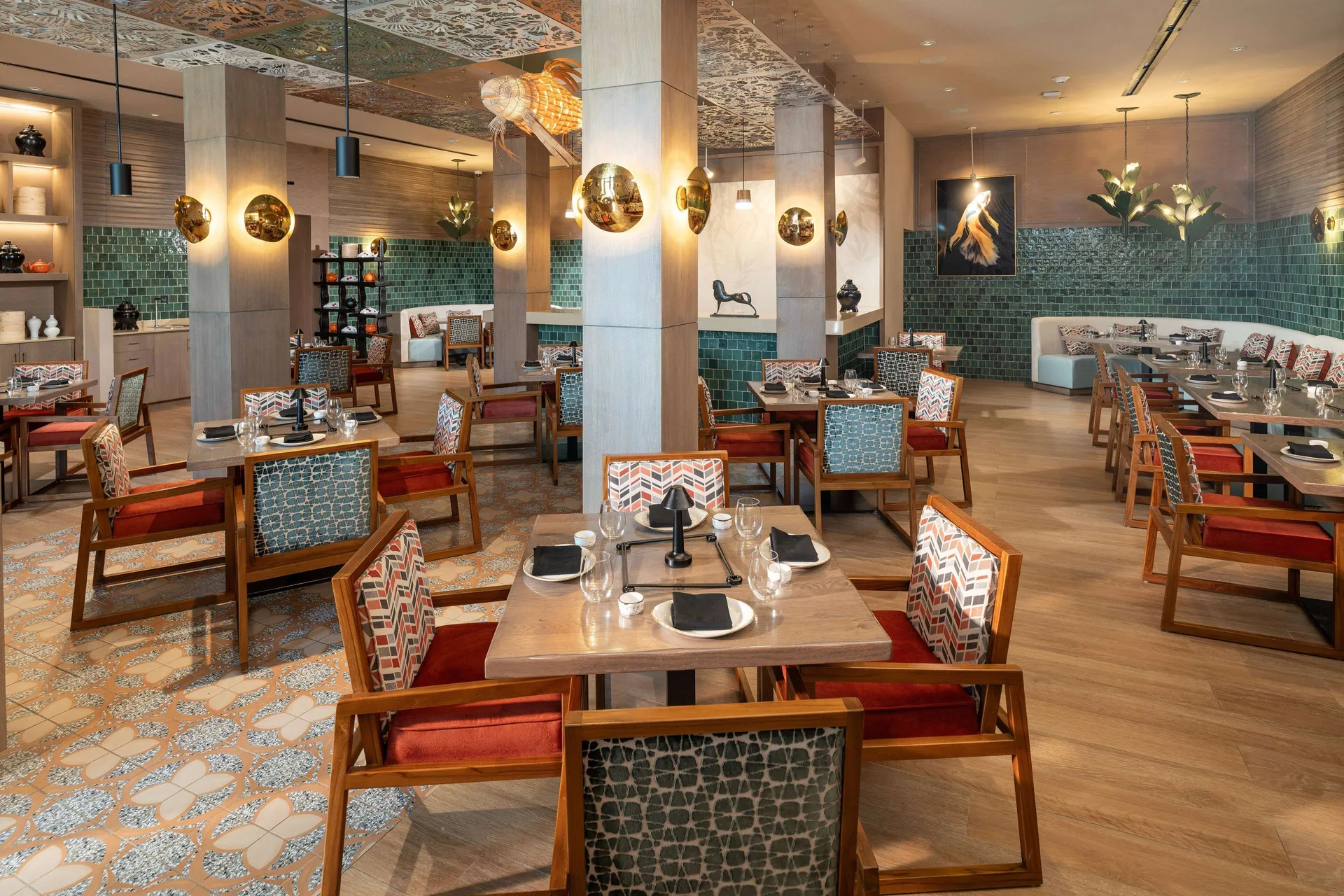 Colorful restaurant dining room with patterned chairs at Sandals Dunns River.