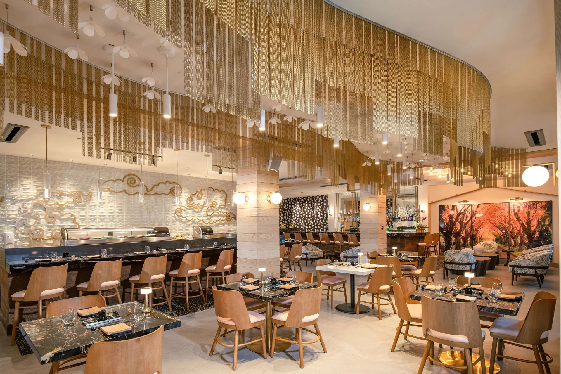 Japanese restaurant with sushi counter and gold ceiling screens at Sandals Dunns River.