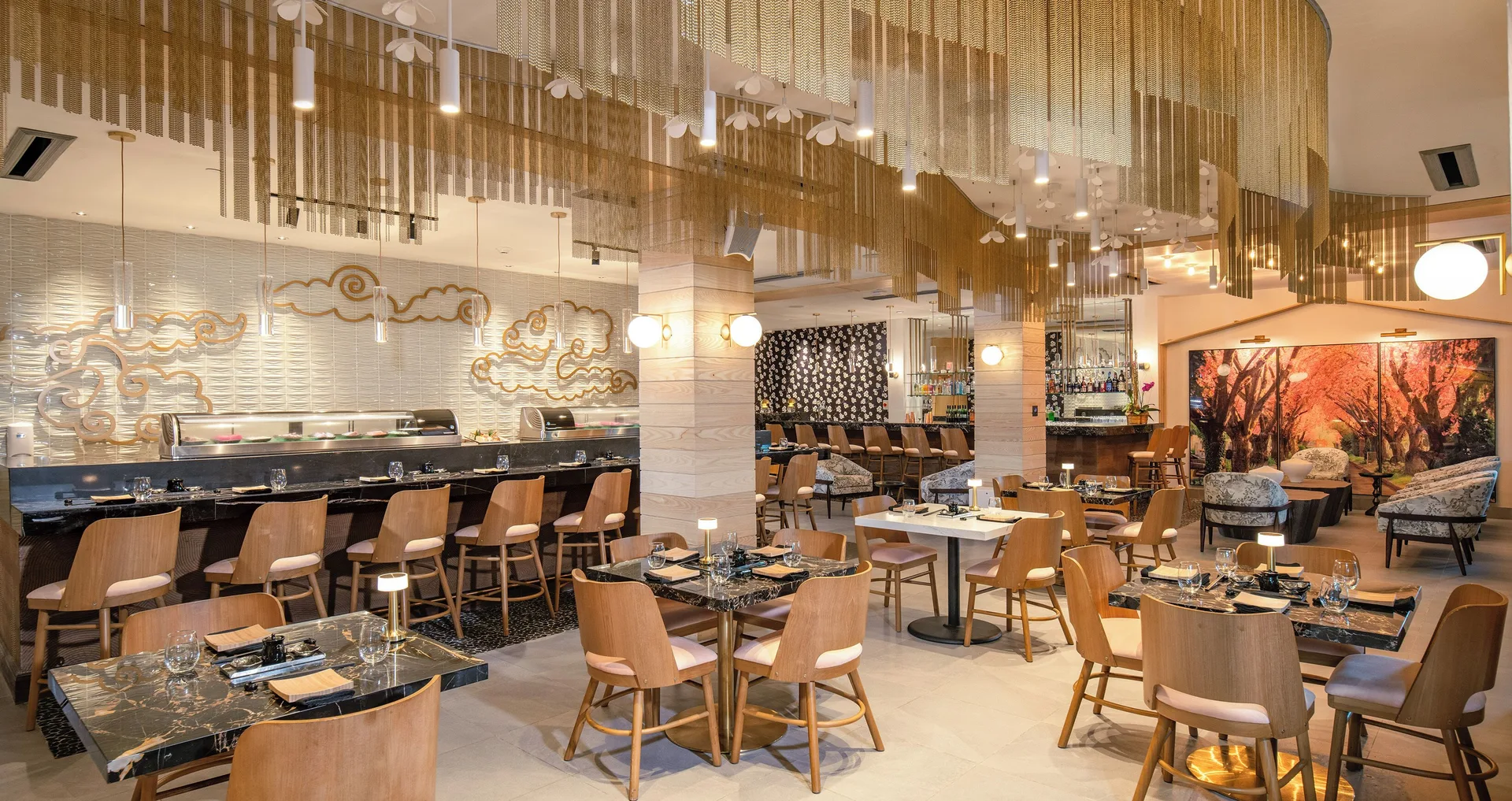 Sushi counter and modern dining room with gold ceiling accents at Sandals Dunns River.