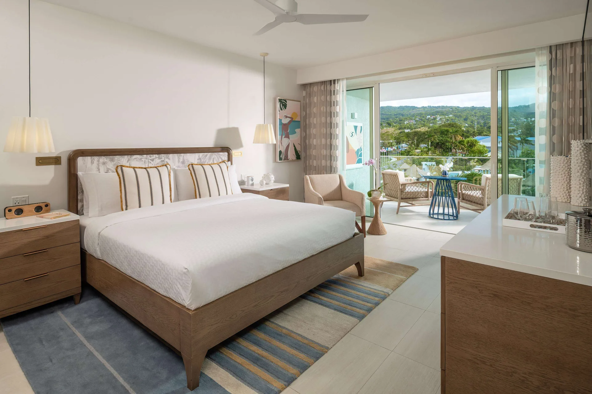 Luxury Room king bed with balcony and garden view at Sandals Dunns River.