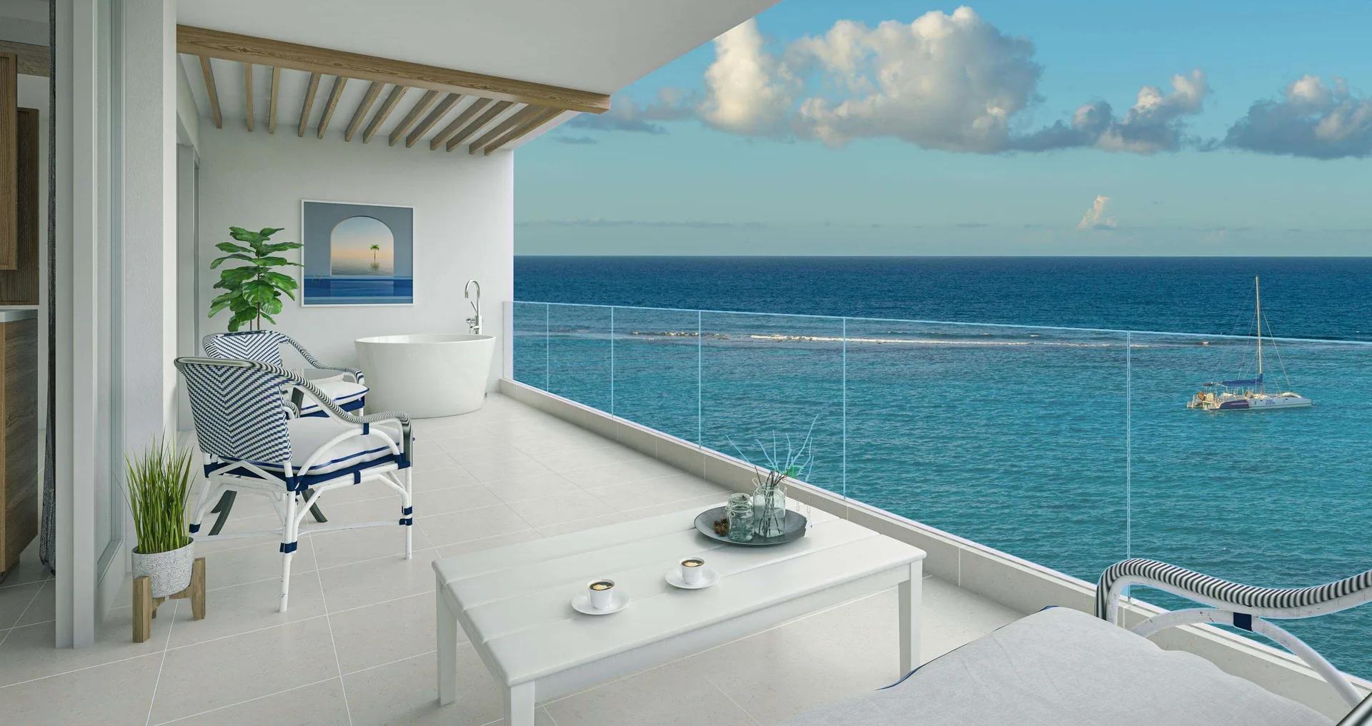 Oceanfront balcony with lounge chairs and soaking tub at Sandals Dunns River.