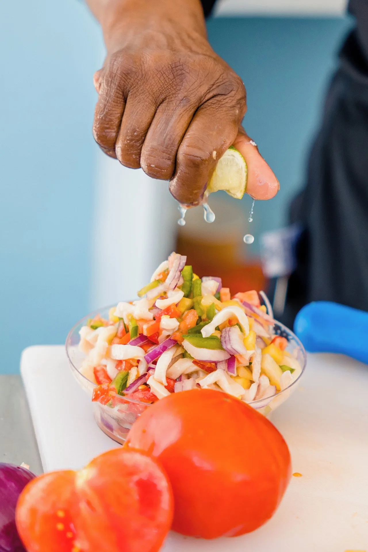 Fresh conch salad being finished with lime at Sandyport Beach Resort.