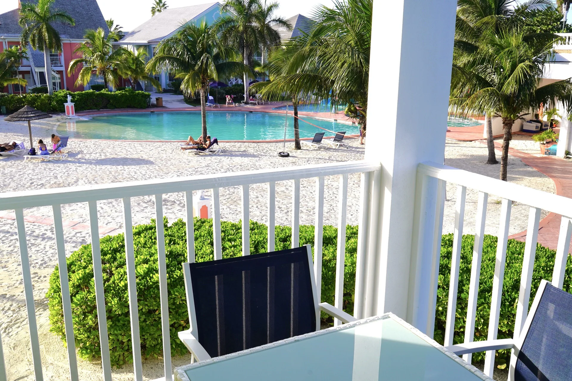 Standard Studio balcony overlooking the pool at Sandyport Beach Resort.