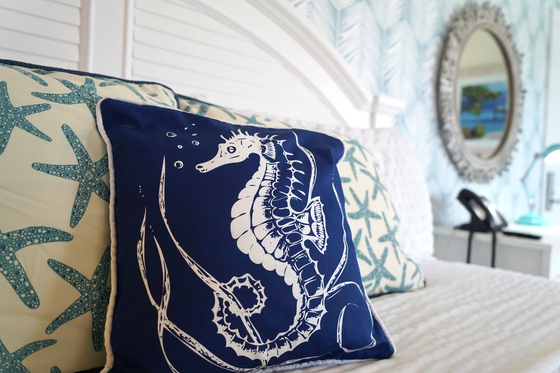 Standard Studio bed pillows with seahorse decor at Sandyport Beach Resort.
