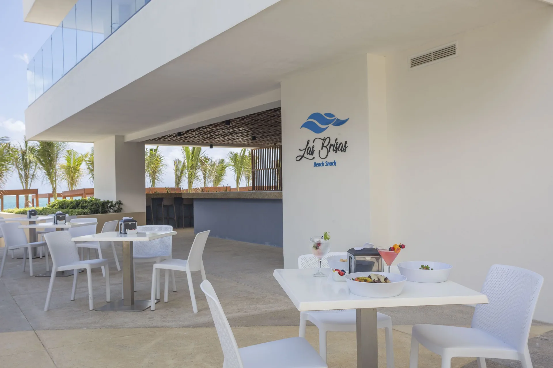 Las Brisas outdoor beach snack seating at Sensira Resort & Spa Riviera Maya.