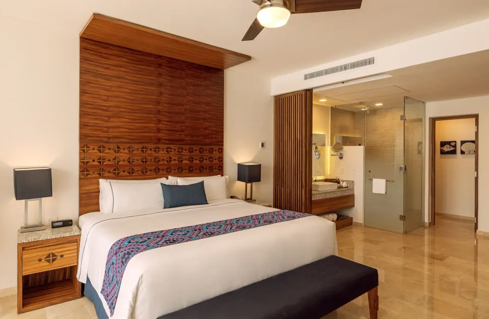 Agatha king room with open vanity and glass shower at Sensira Resort & Spa Riviera Maya.