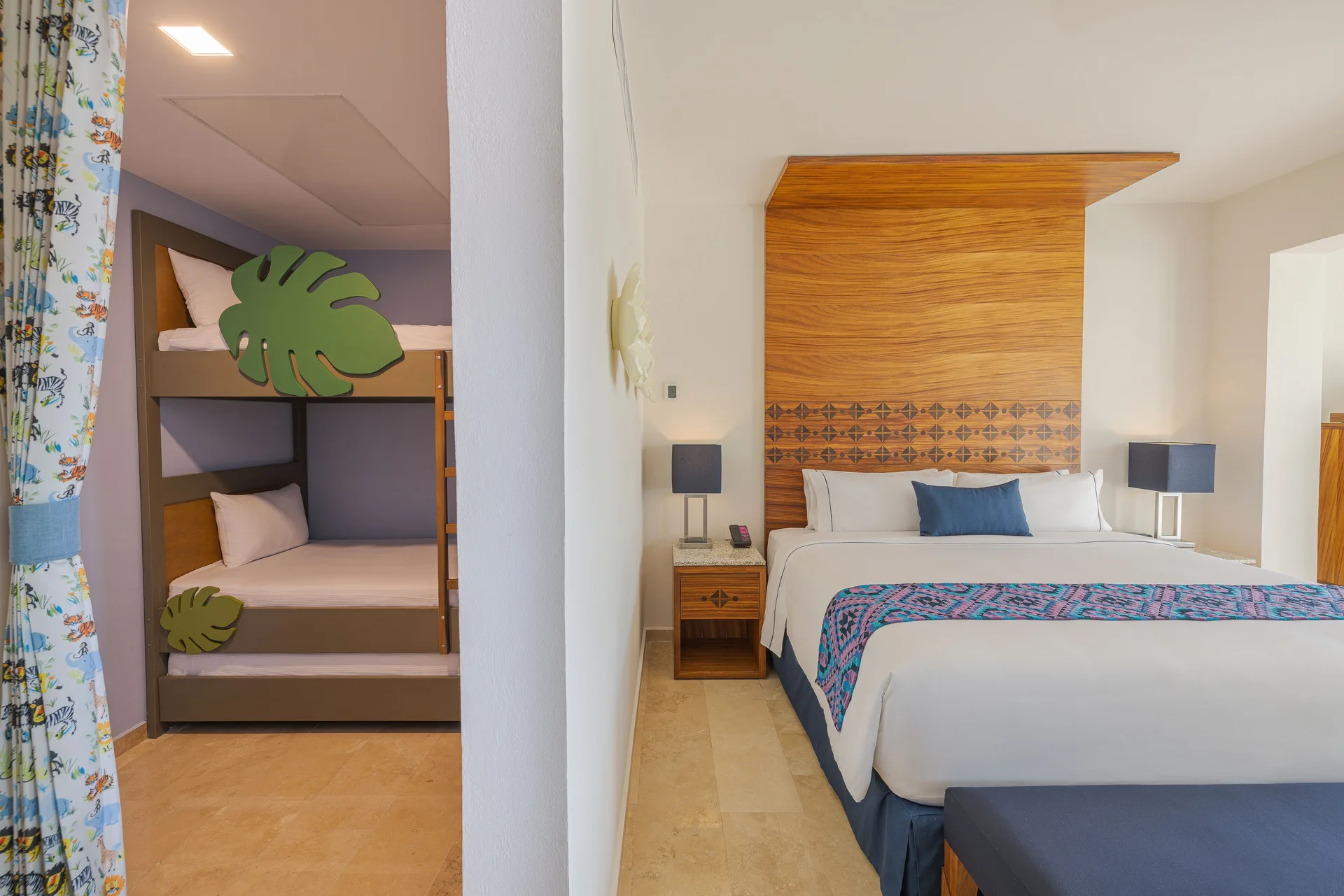 Sapphire Room king bed and bunk beds at Sensira Resort & Spa Riviera Maya.