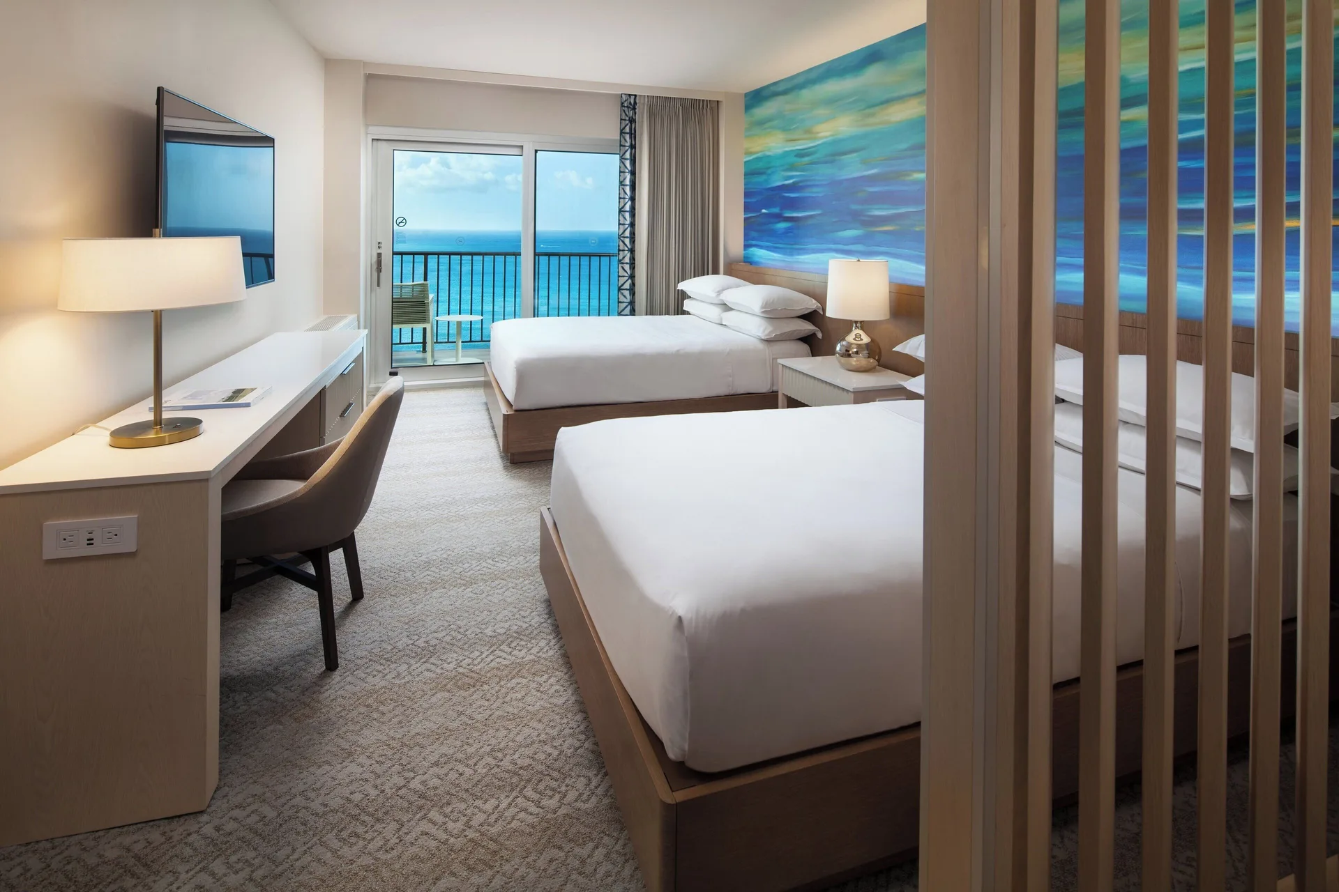 Penthouse oceanfront two-bed room with balcony at Sheraton Waikiki Beach Resort.
