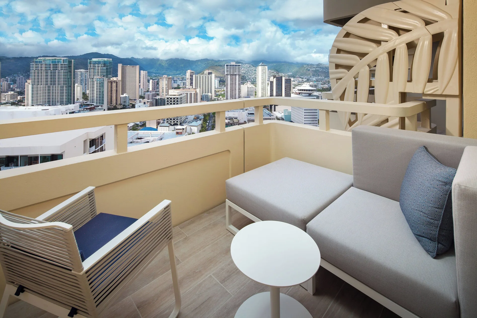 City View room balcony seating with Honolulu skyline at Sheraton Waikiki Beach Resort.