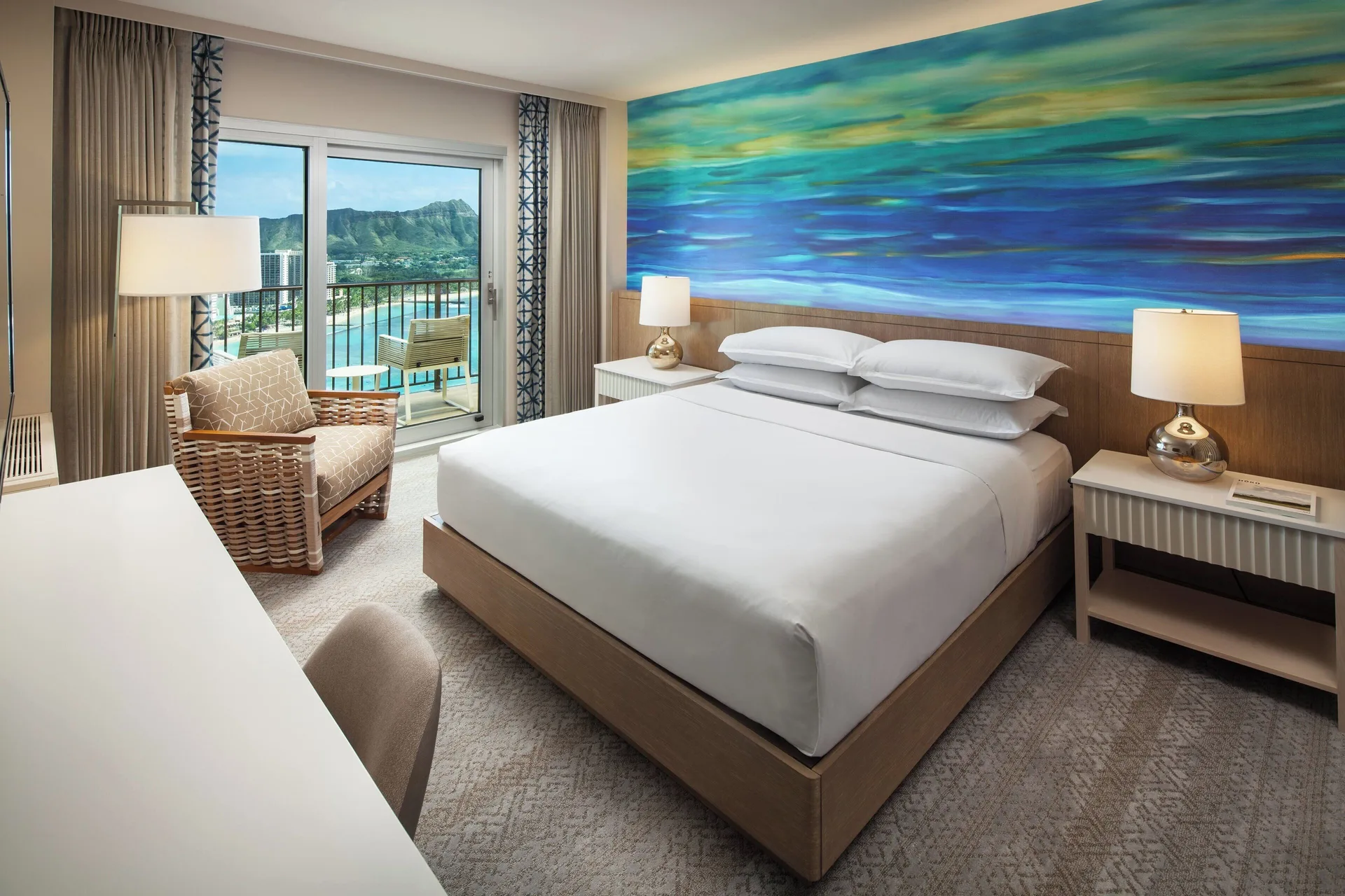Oceanfront Diamond Head king room with balcony view at Sheraton Waikiki Beach Resort.
