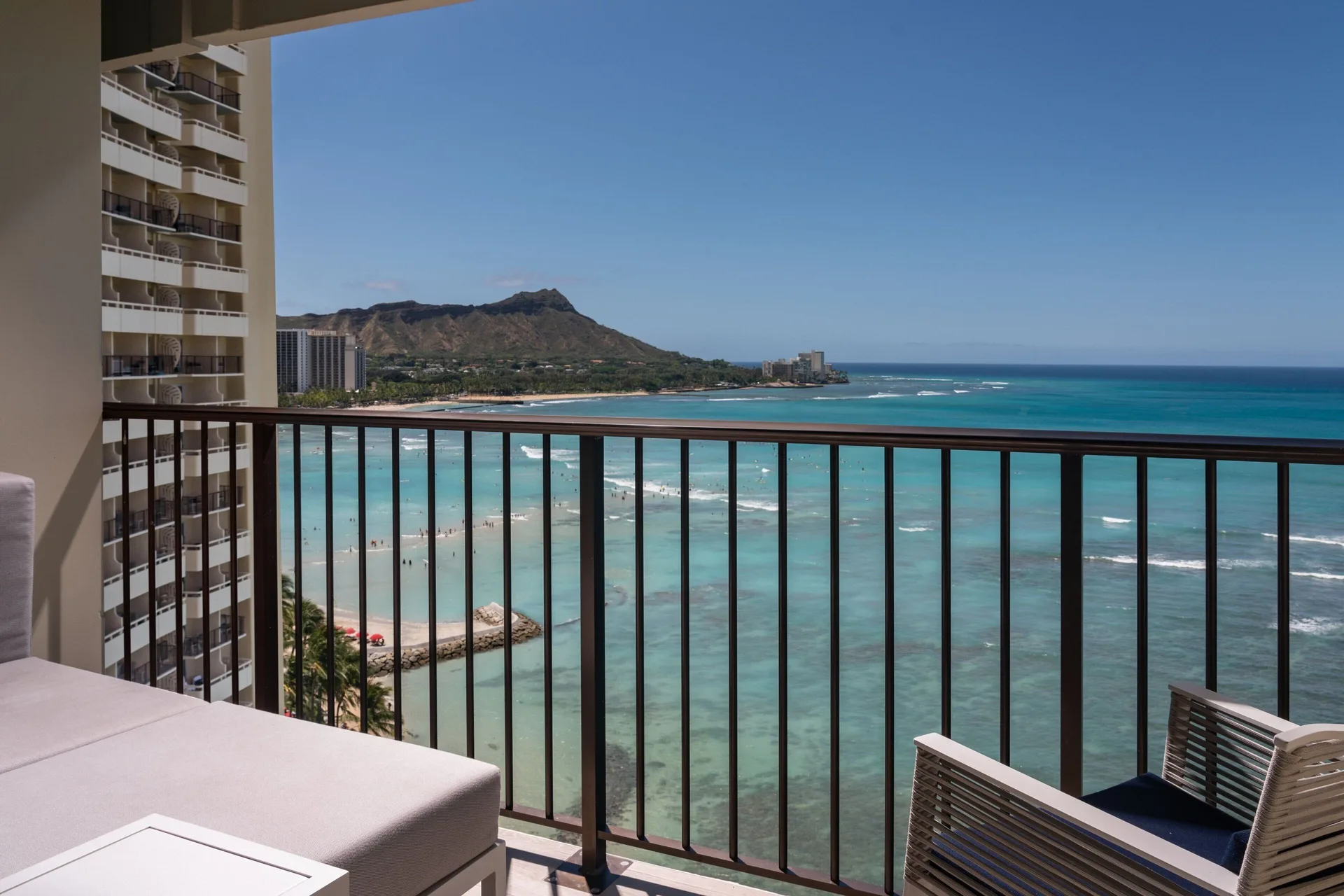 Oceanfront balcony overlooking Waikiki Beach at Sheraton Waikiki Beach Resort.