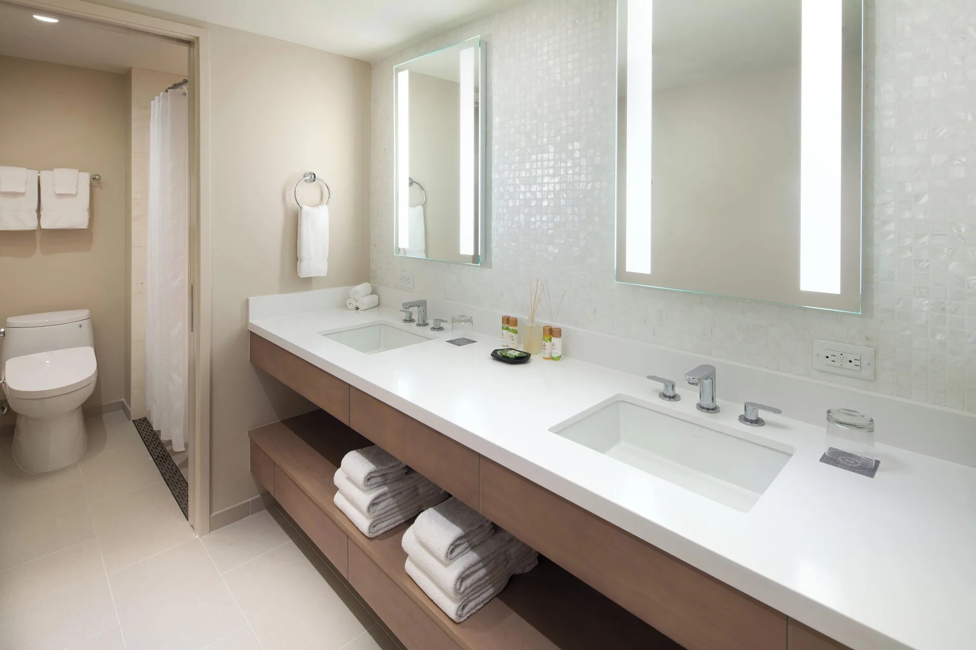 Malia Suite bathroom vanity with double sinks at Sheraton Waikiki Beach Resort.