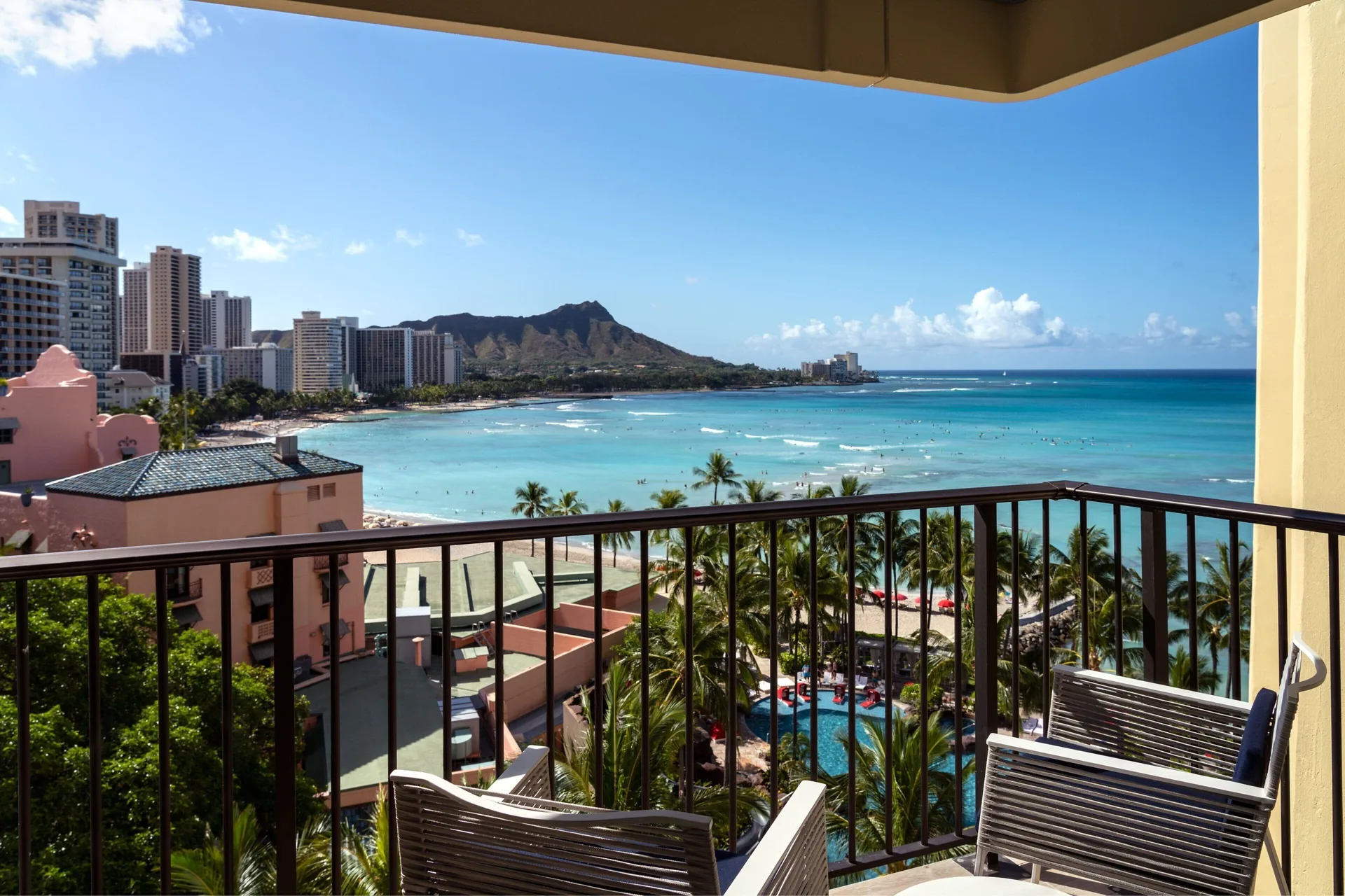 Malia Suite furnished balcony with ocean and Diamond Head view at Sheraton Waikiki Beach Resort.