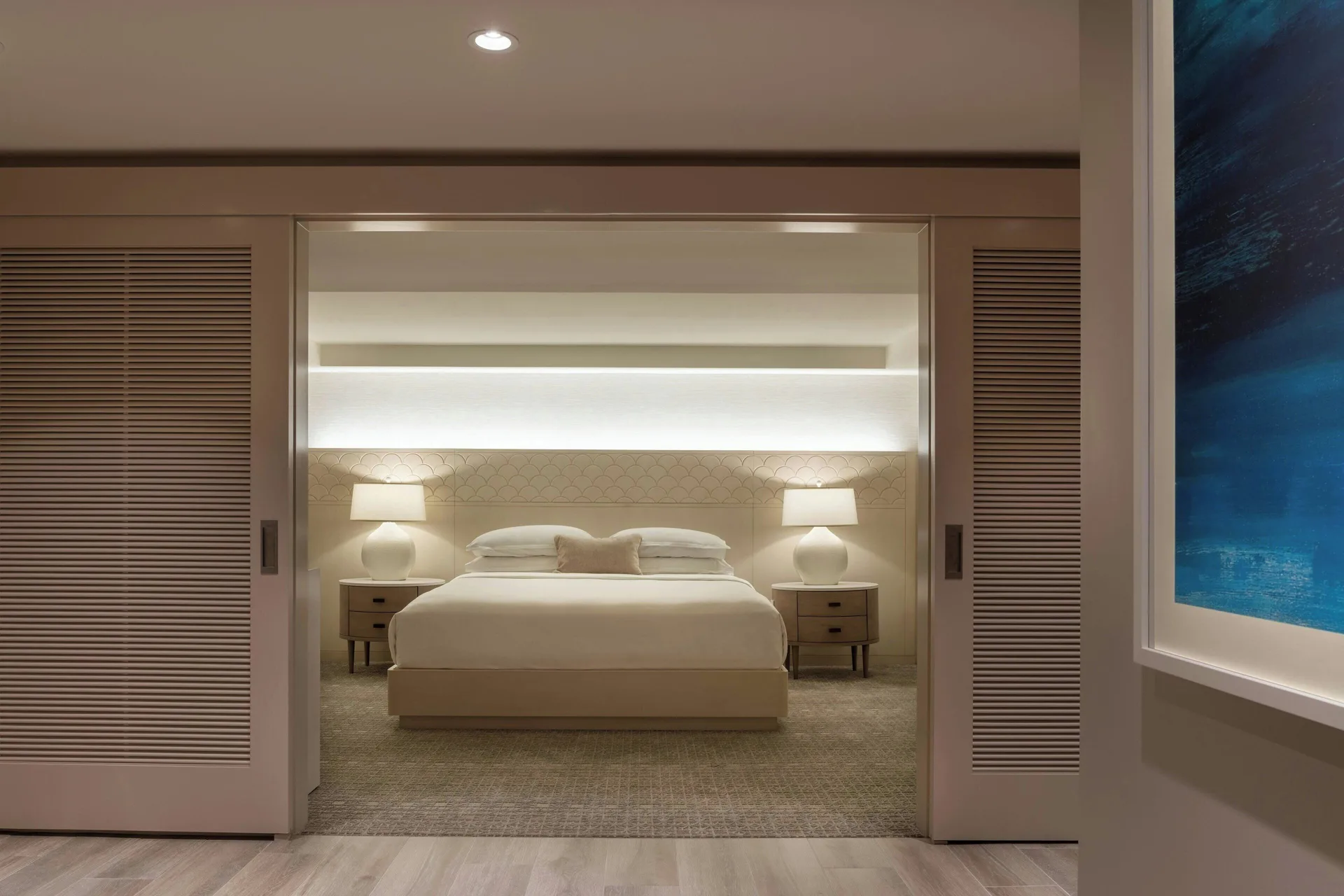 Malia Suite bedroom seen through sliding doors at Sheraton Waikiki Beach Resort.