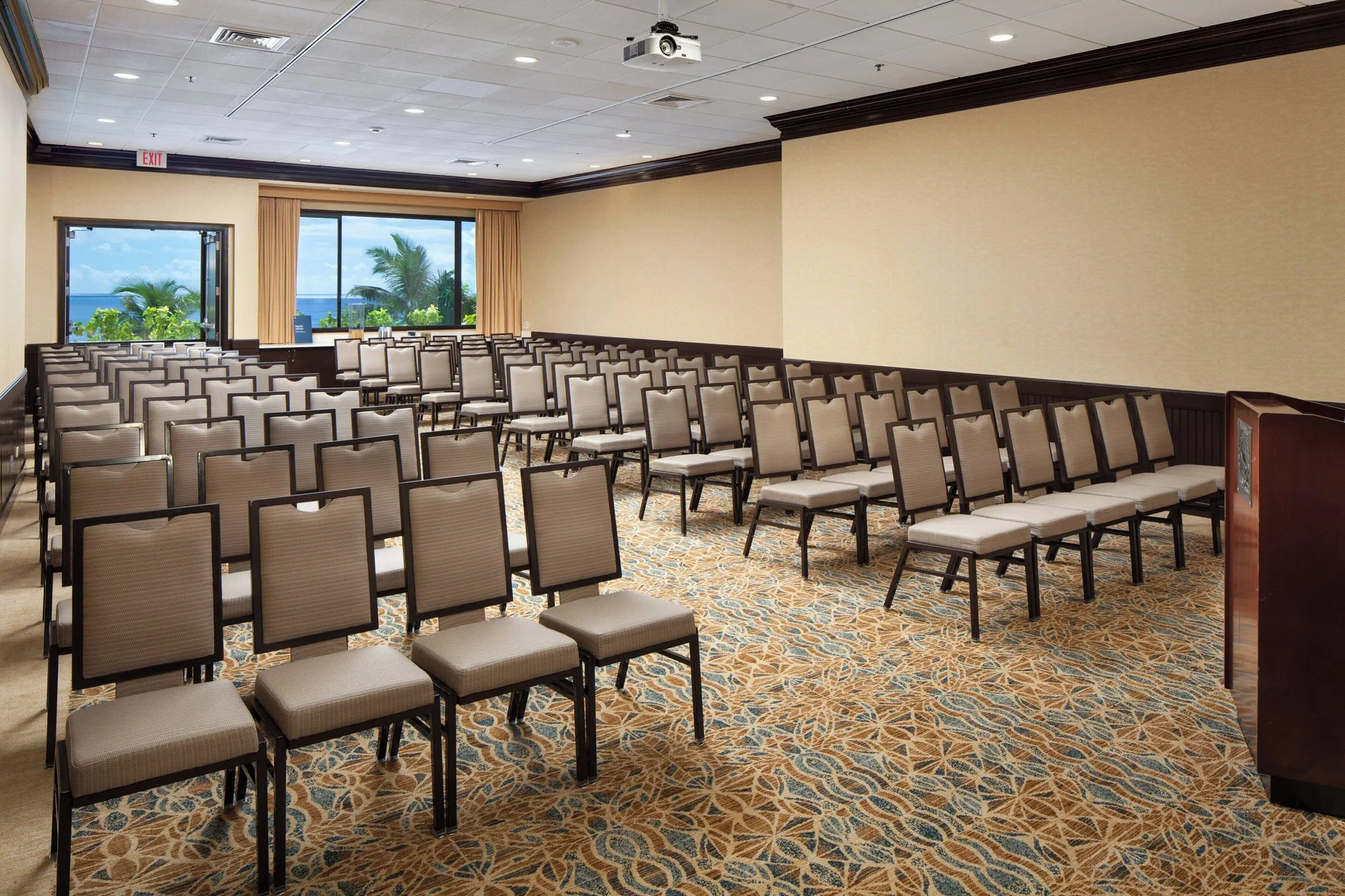 Meeting room with theater seating and ocean-facing windows at Sheraton Waikiki Beach Resort.