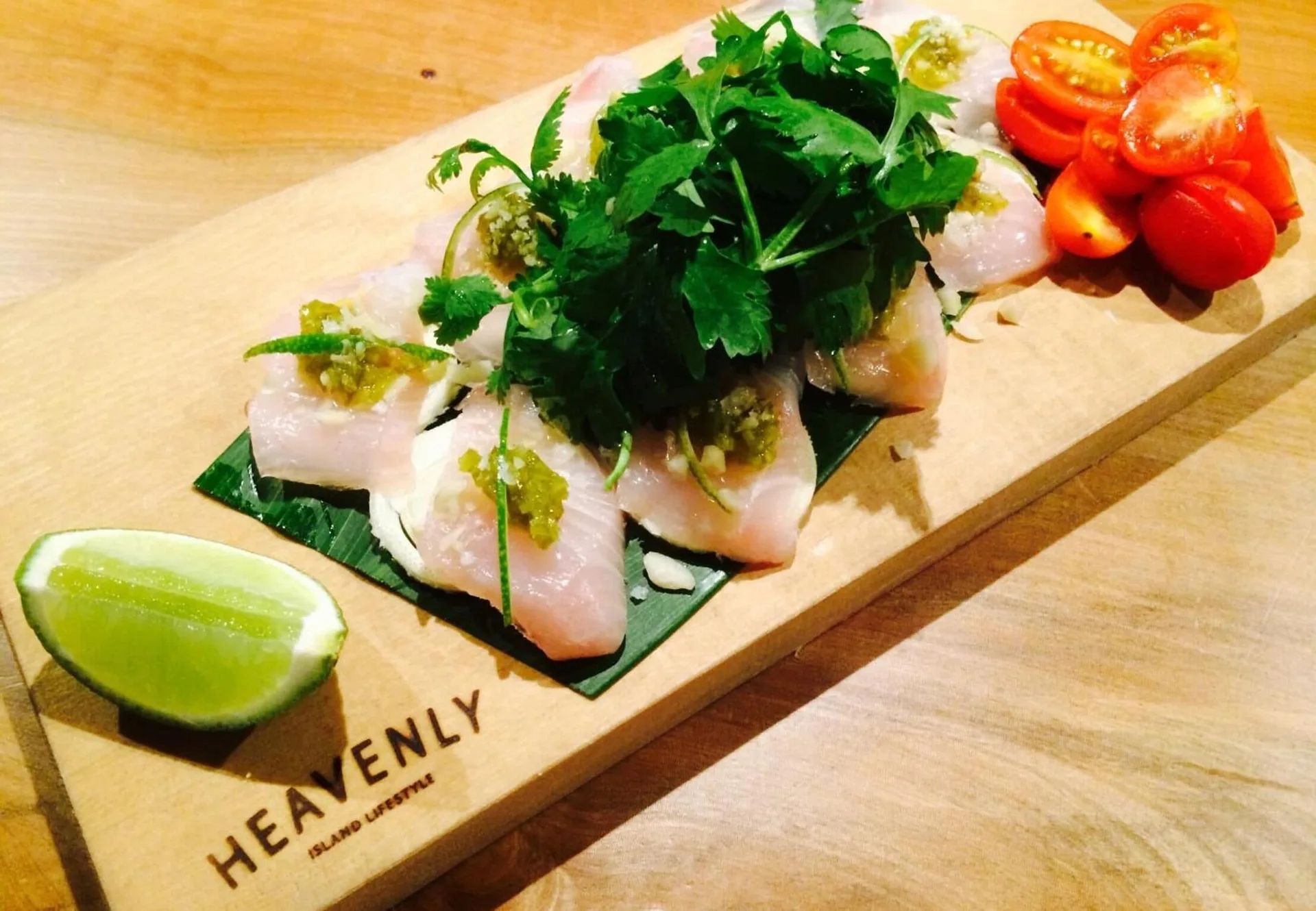 Seafood dish with herbs, lime, and tomatoes at Shoreline Hotel Waikiki.