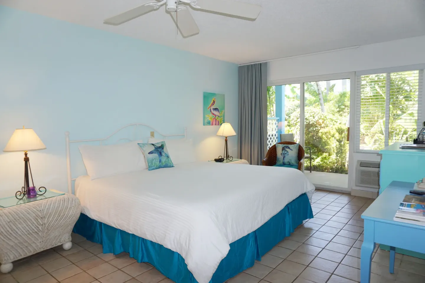 Courtyard View room with one bed and garden-facing doors at Sibonné Beach Hotel.