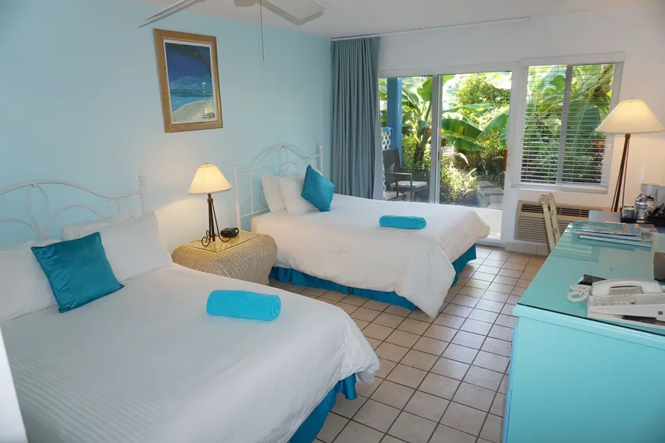 Courtyard View room with two beds and patio doors at Sibonné Beach Hotel.