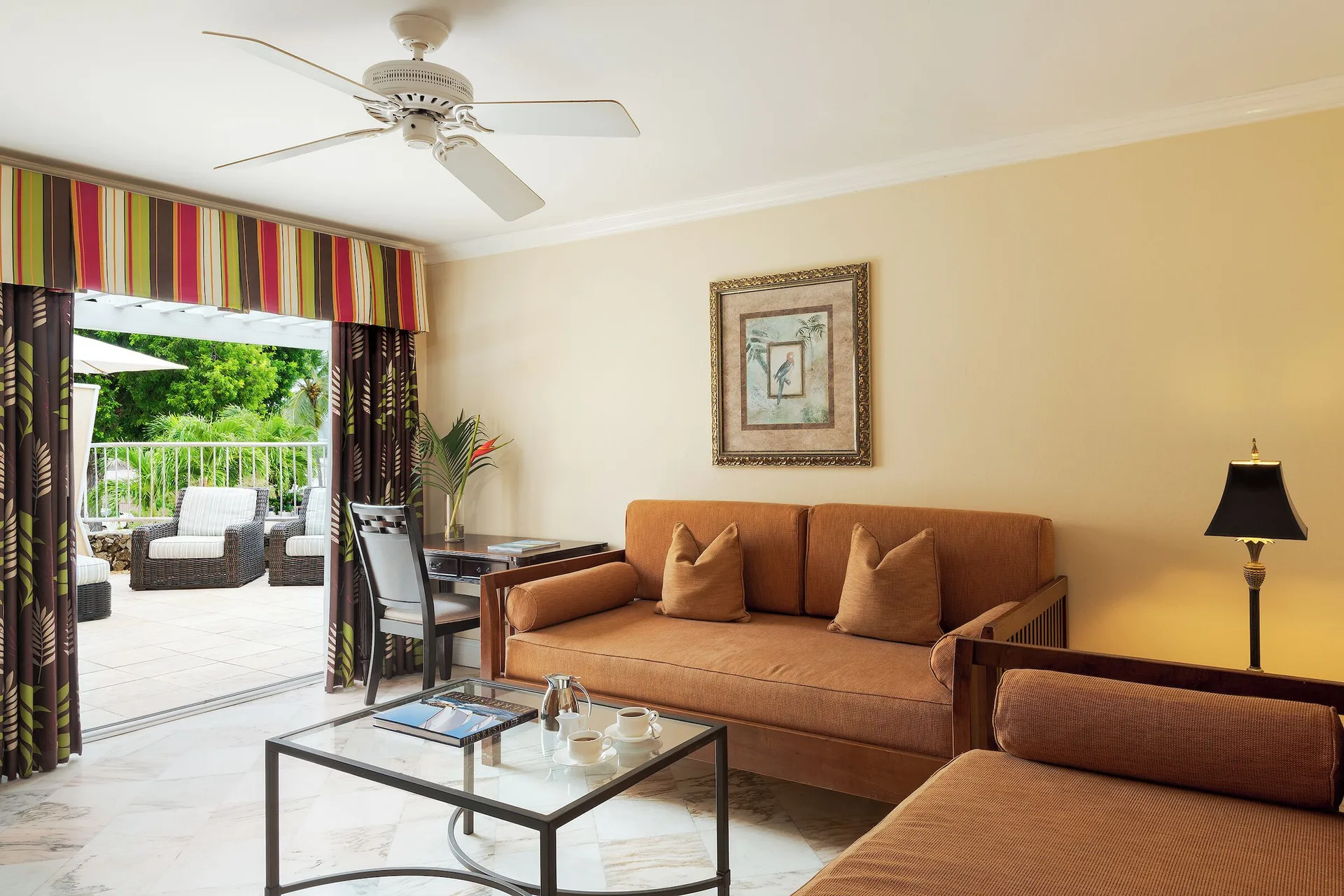 Frigate Suite sitting area with terrace access at The Buccaneer Beach & Golf Resort.
