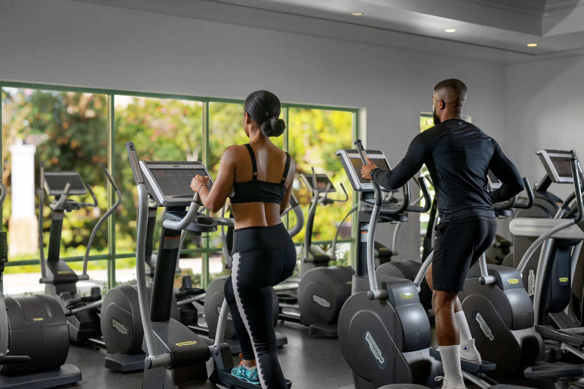 Two guests use elliptical machines in the fitness center at The Coral at Atlantis.