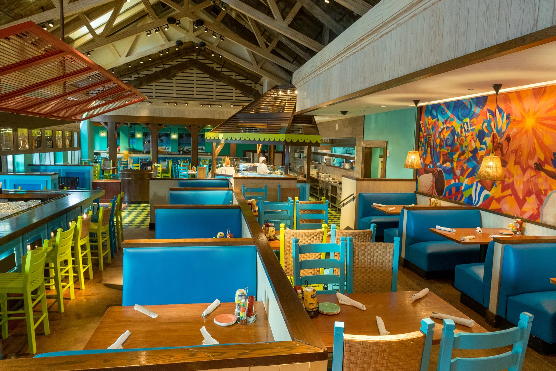 A colorful Caribbean-style restaurant dining room at The Coral at Atlantis.