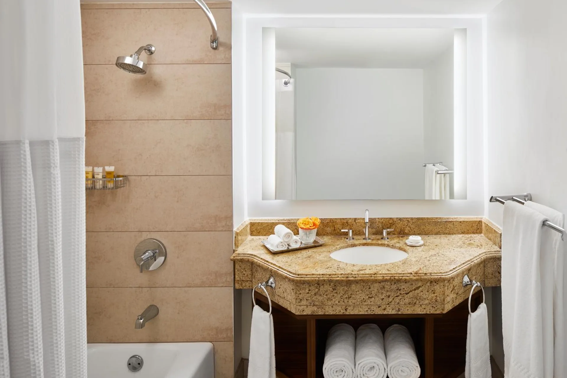 Terrace View Room bathroom with vanity and tub-shower at The Coral at Atlantis.