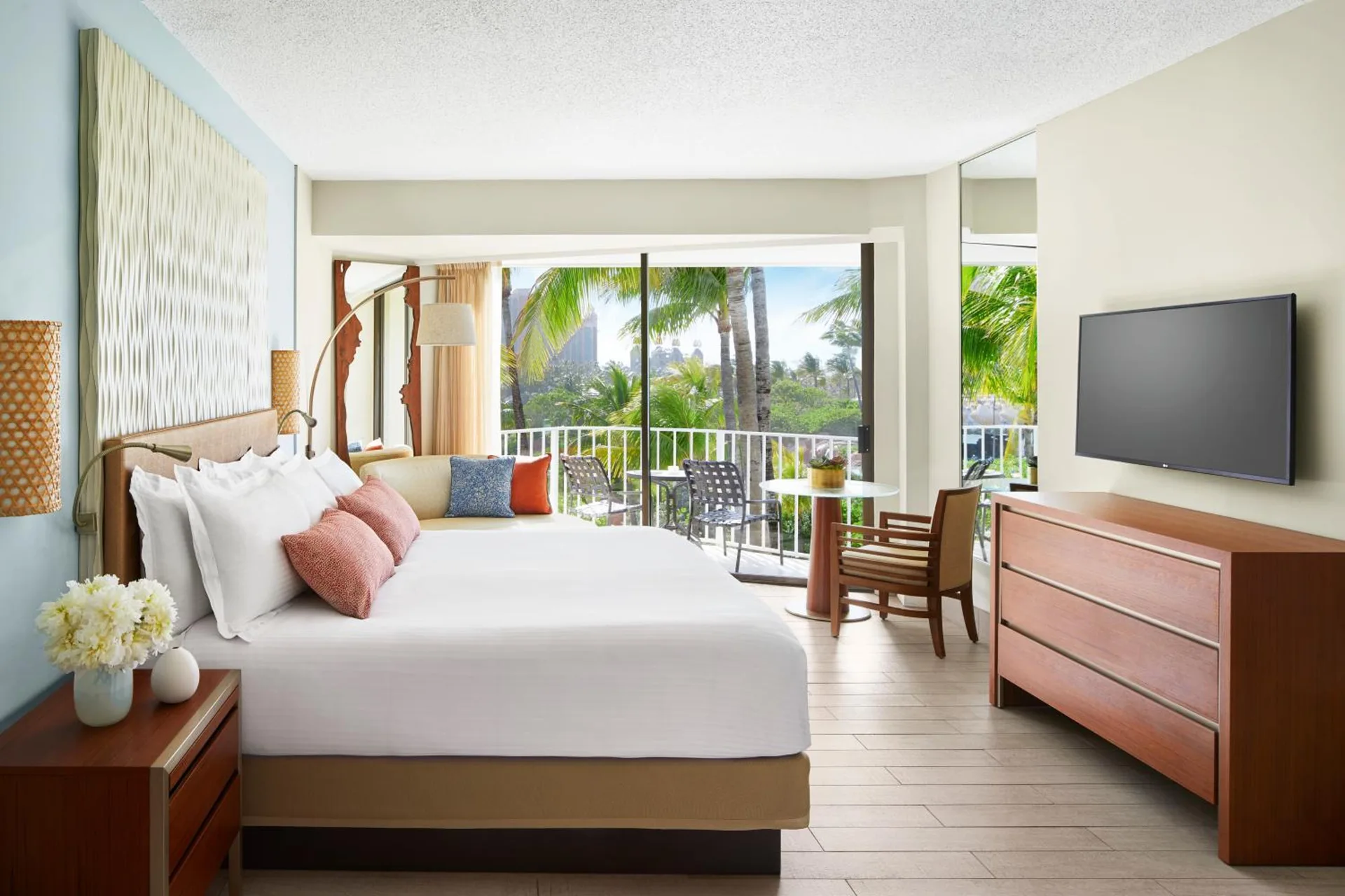 Terrace View Room with king bed and balcony seating at The Coral at Atlantis.