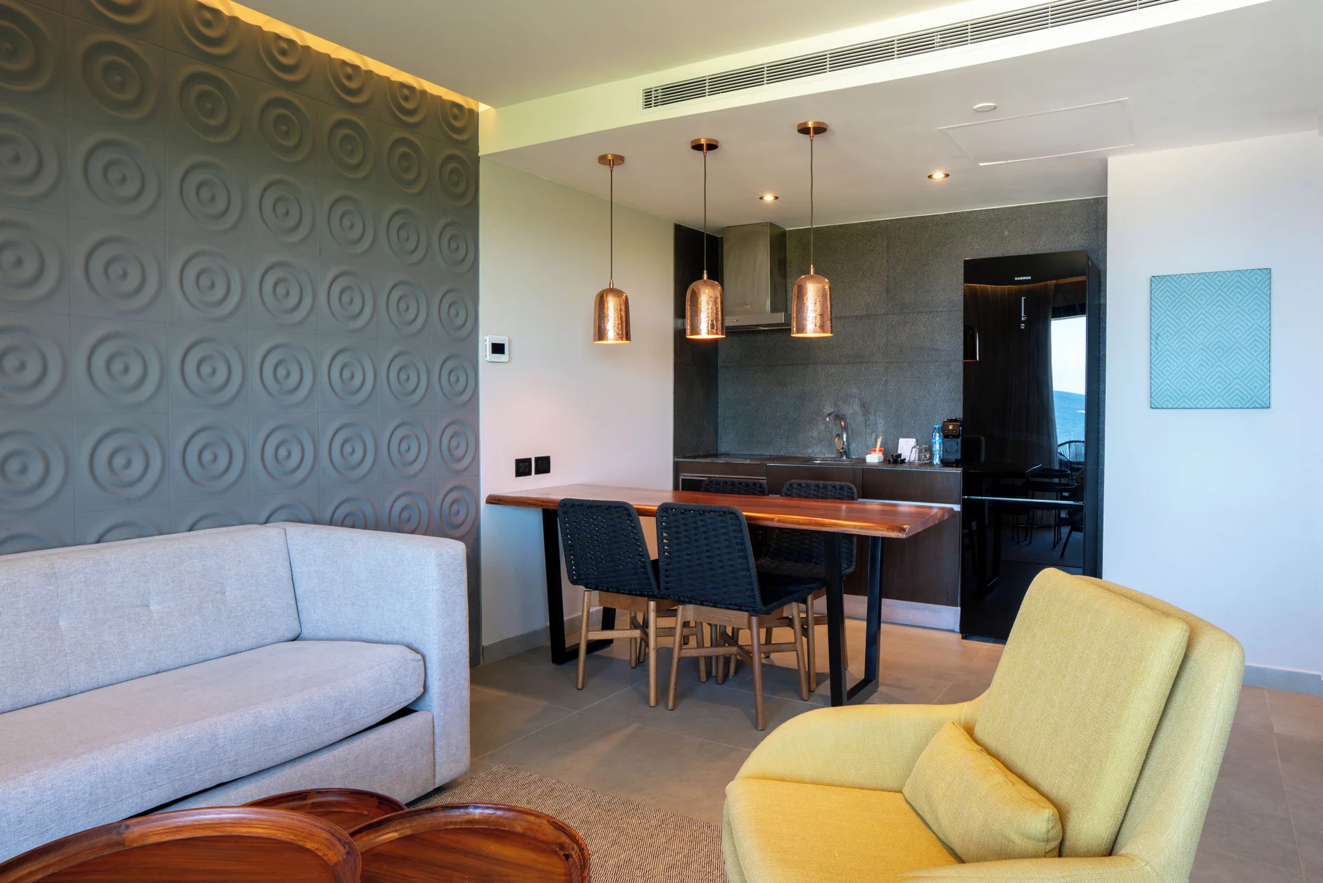 Living and dining area in a 1 Bedroom Oceanview Residence at The Fives Oceanfront Riviera Maya.