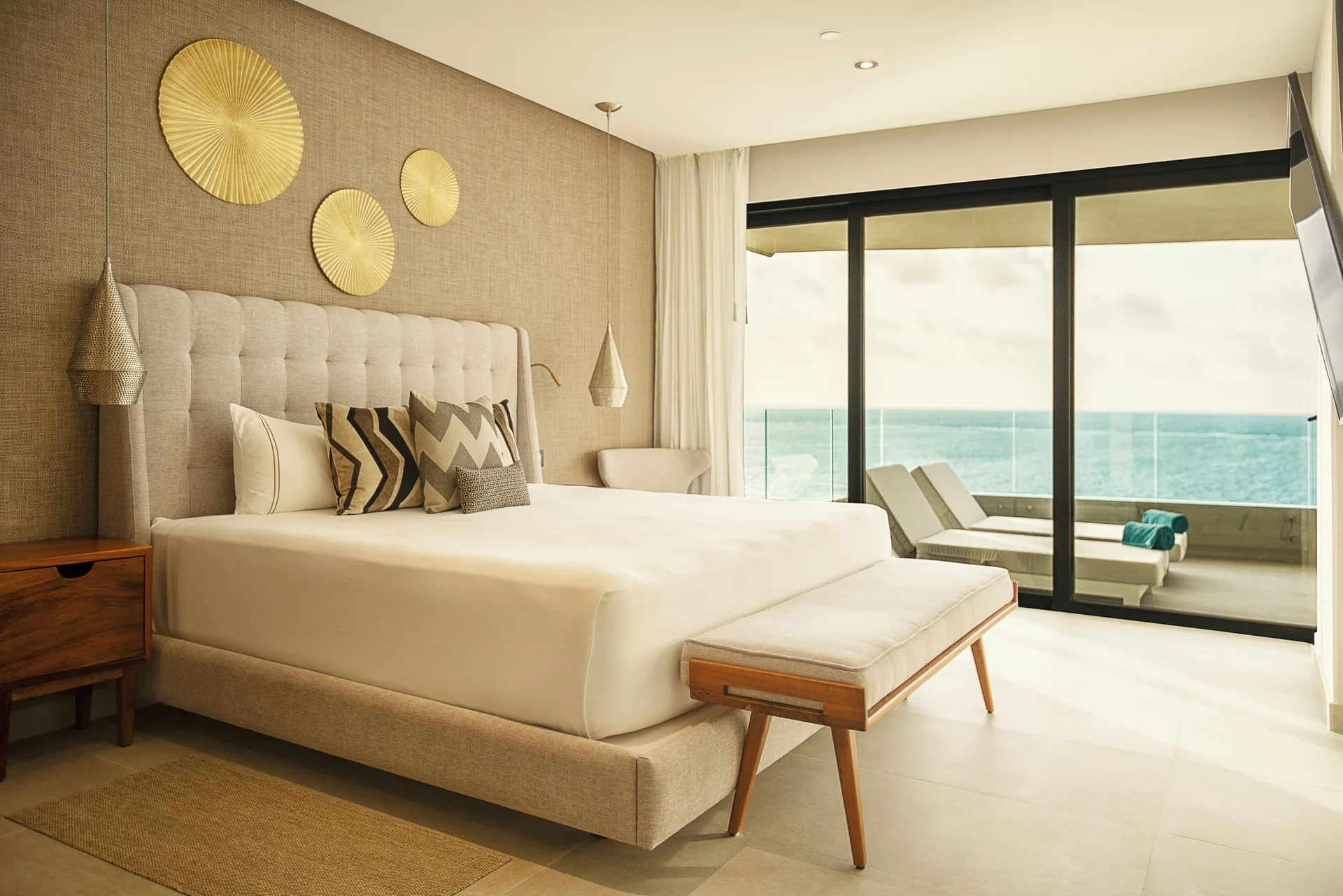King bedroom with ocean-facing balcony at The Fives Oceanfront Riviera Maya.