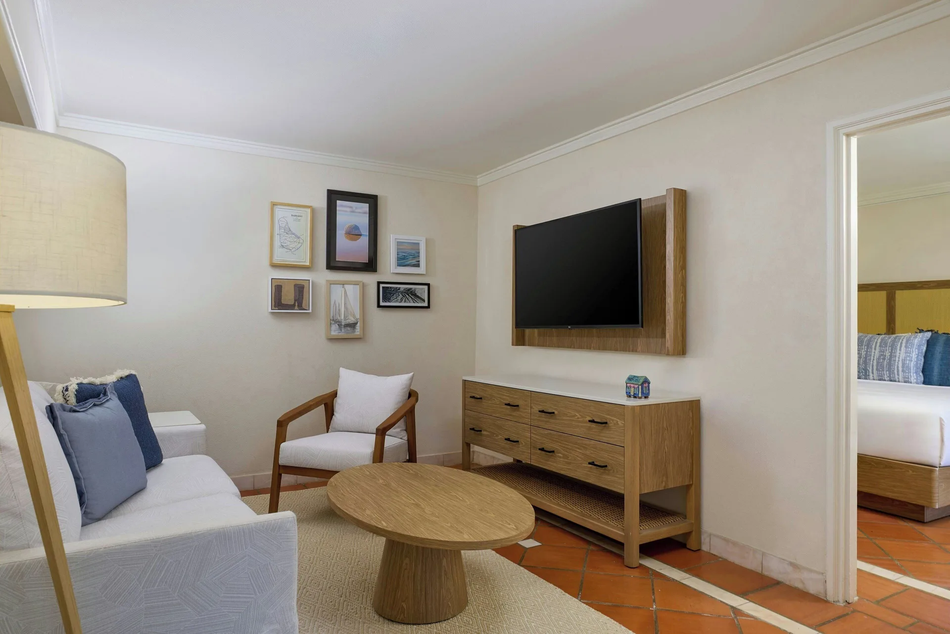 Luxury Garden View sitting area with sofa and TV at The House.