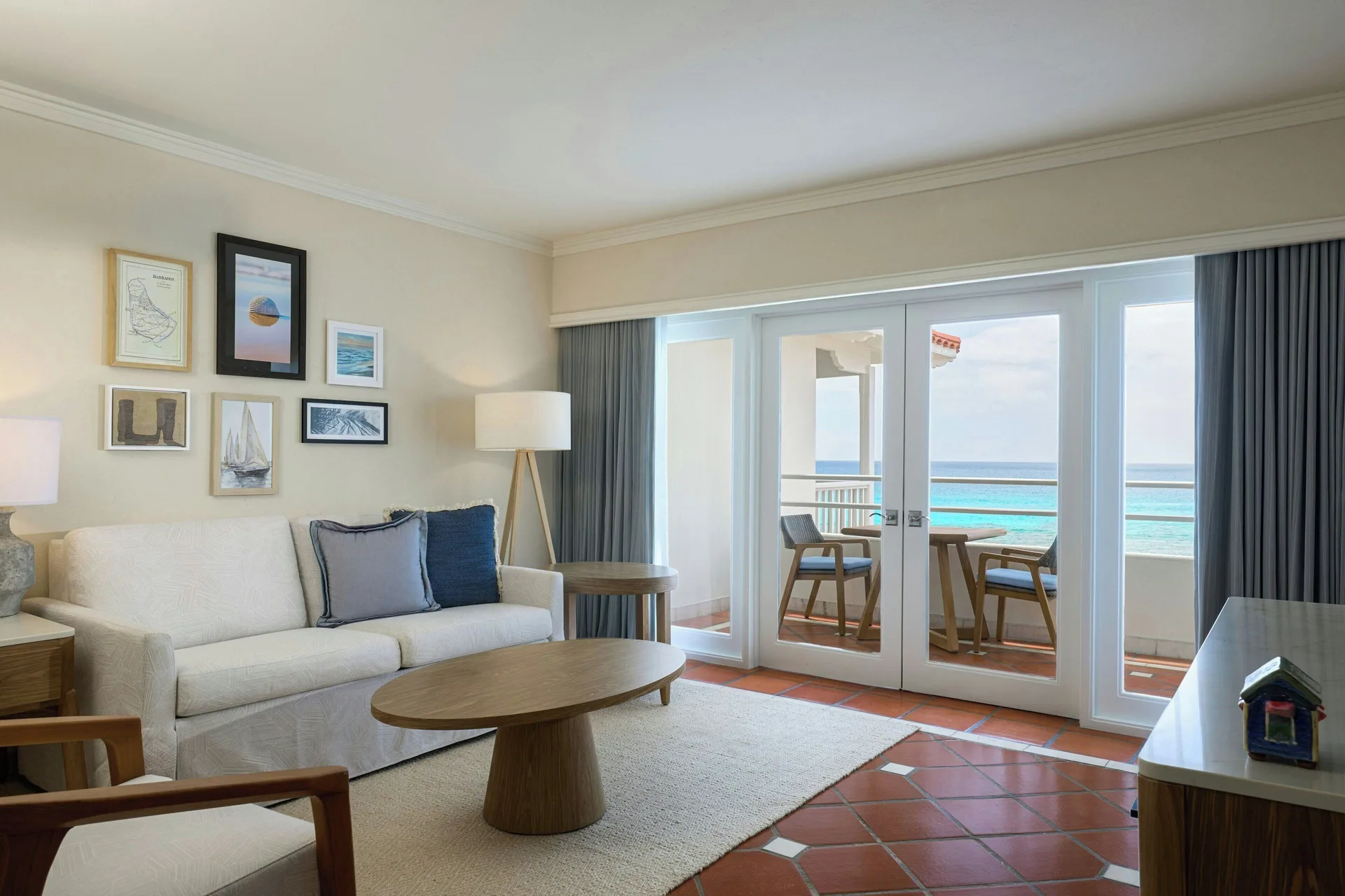 Ocean View 1 Bedroom Suite living room with sofa and balcony doors at The House.