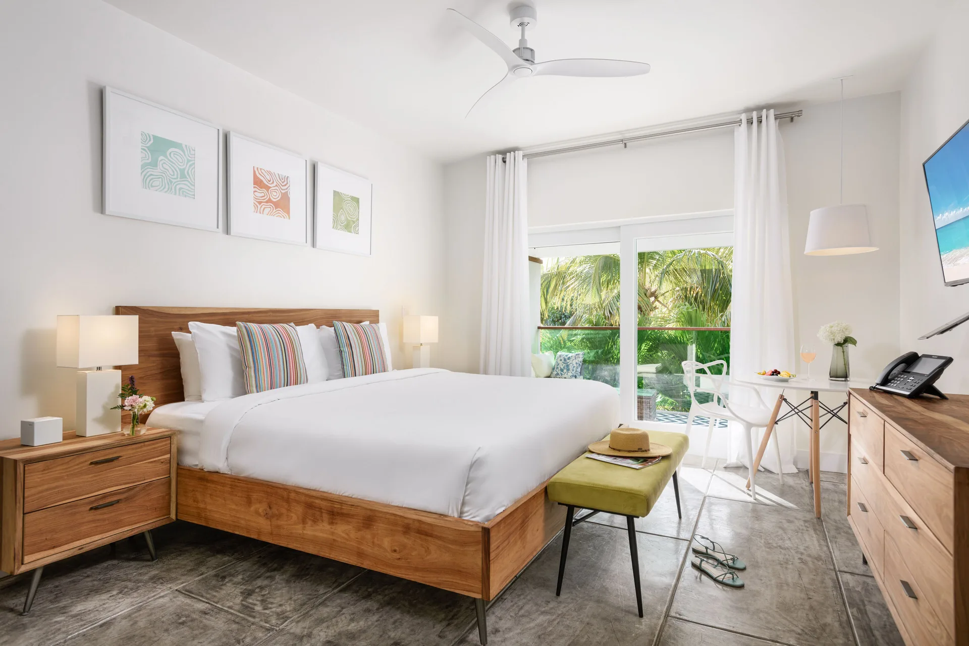 Luxury Room king bed with seating nook at The Oasis at Grace Bay.
