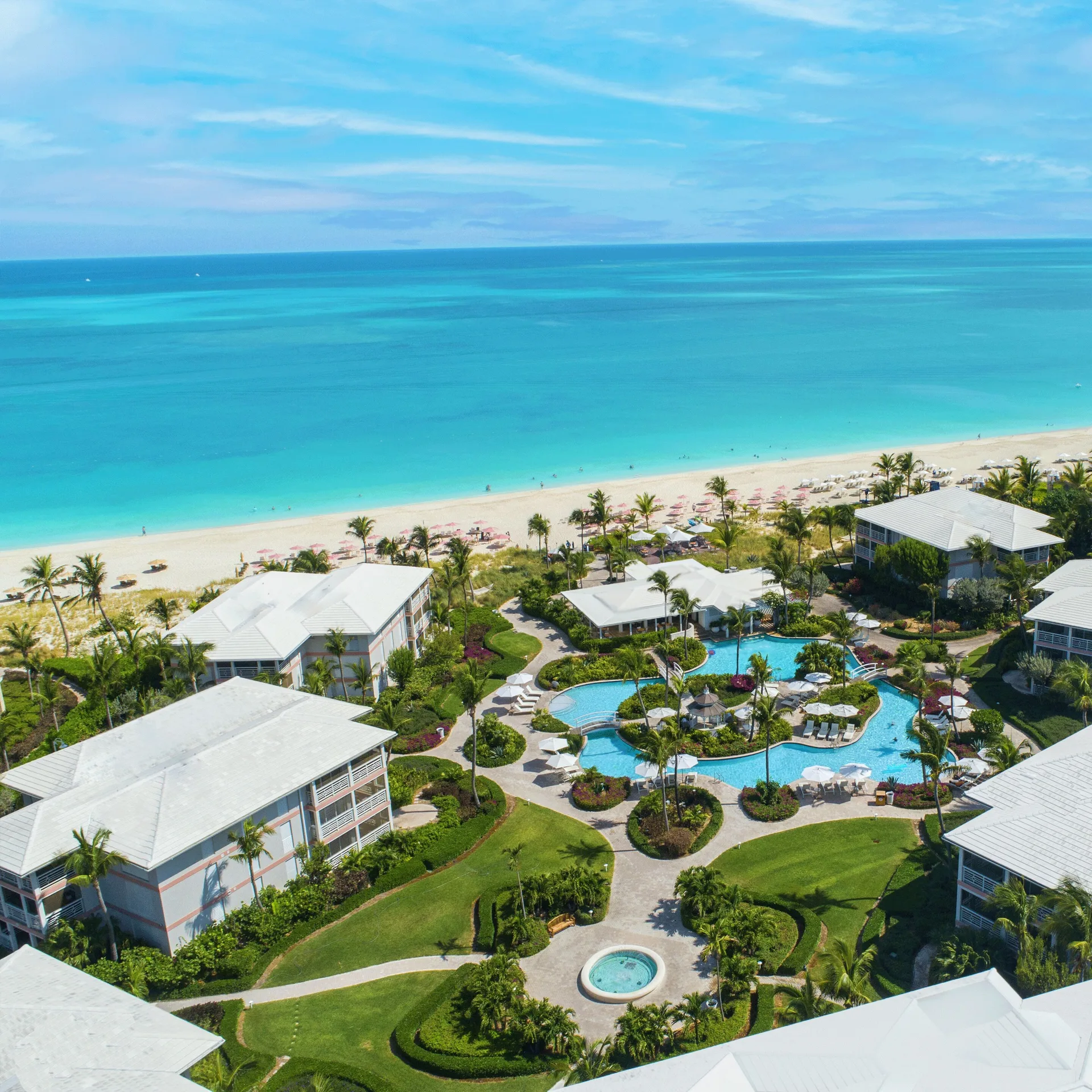 Ocean Club West Grace Bay Beach resort with tropical gardens and beachfront pool