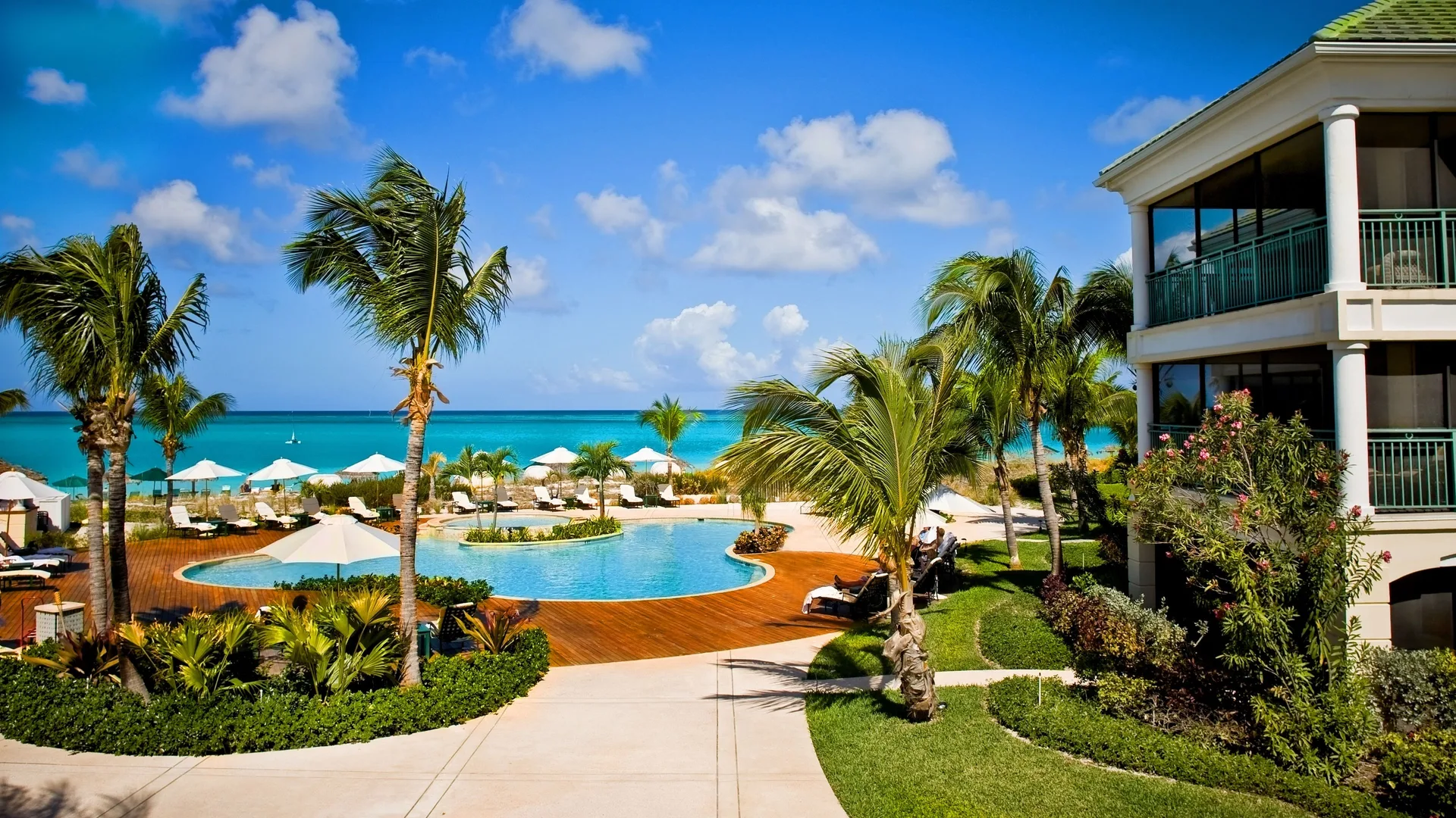Resort pool and ocean view at The Sands at Grace Bay.