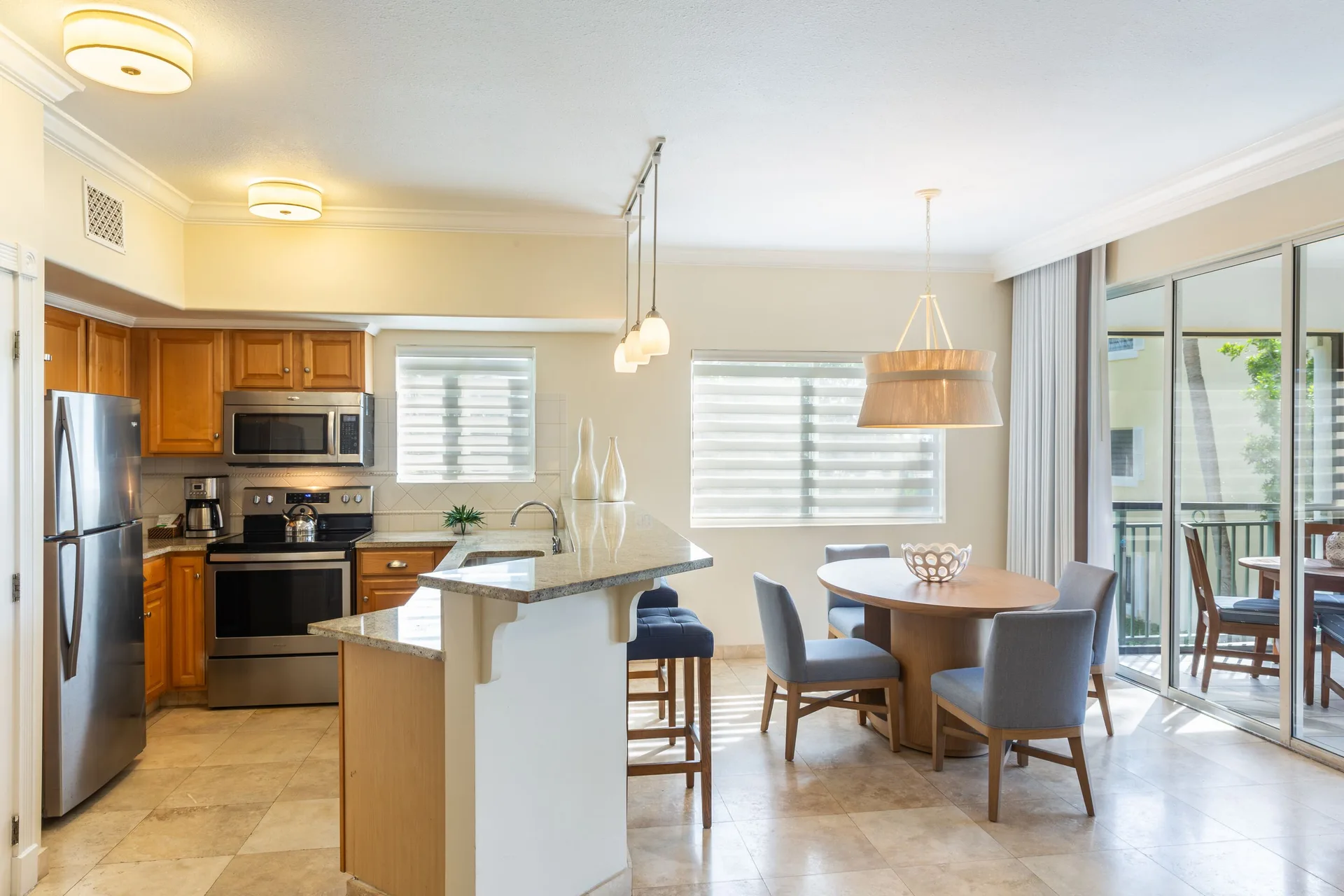 One-bedroom garden view suite kitchen and dining area at The Sands at Grace Bay.