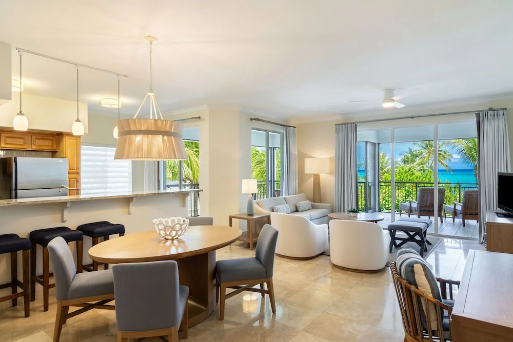 Ocean view suite dining and living area at The Sands at Grace Bay.