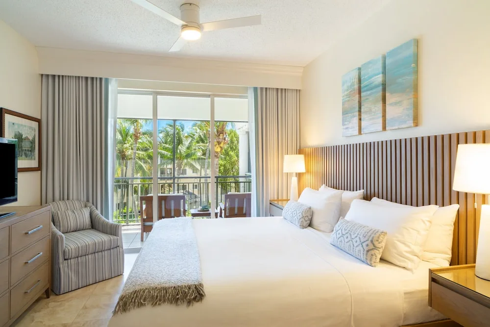 Bedroom with king bed and balcony doors at The Sands at Grace Bay.