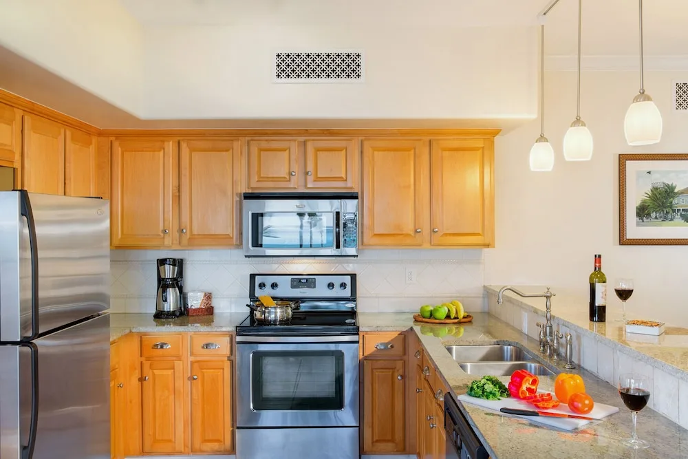 Suite kitchen with appliances and prepared counter at The Sands at Grace Bay.