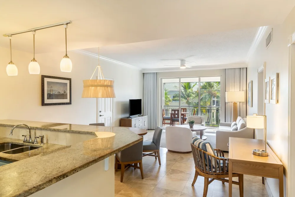 Ocean view two-bedroom suite living and kitchen area at The Sands at Grace Bay.