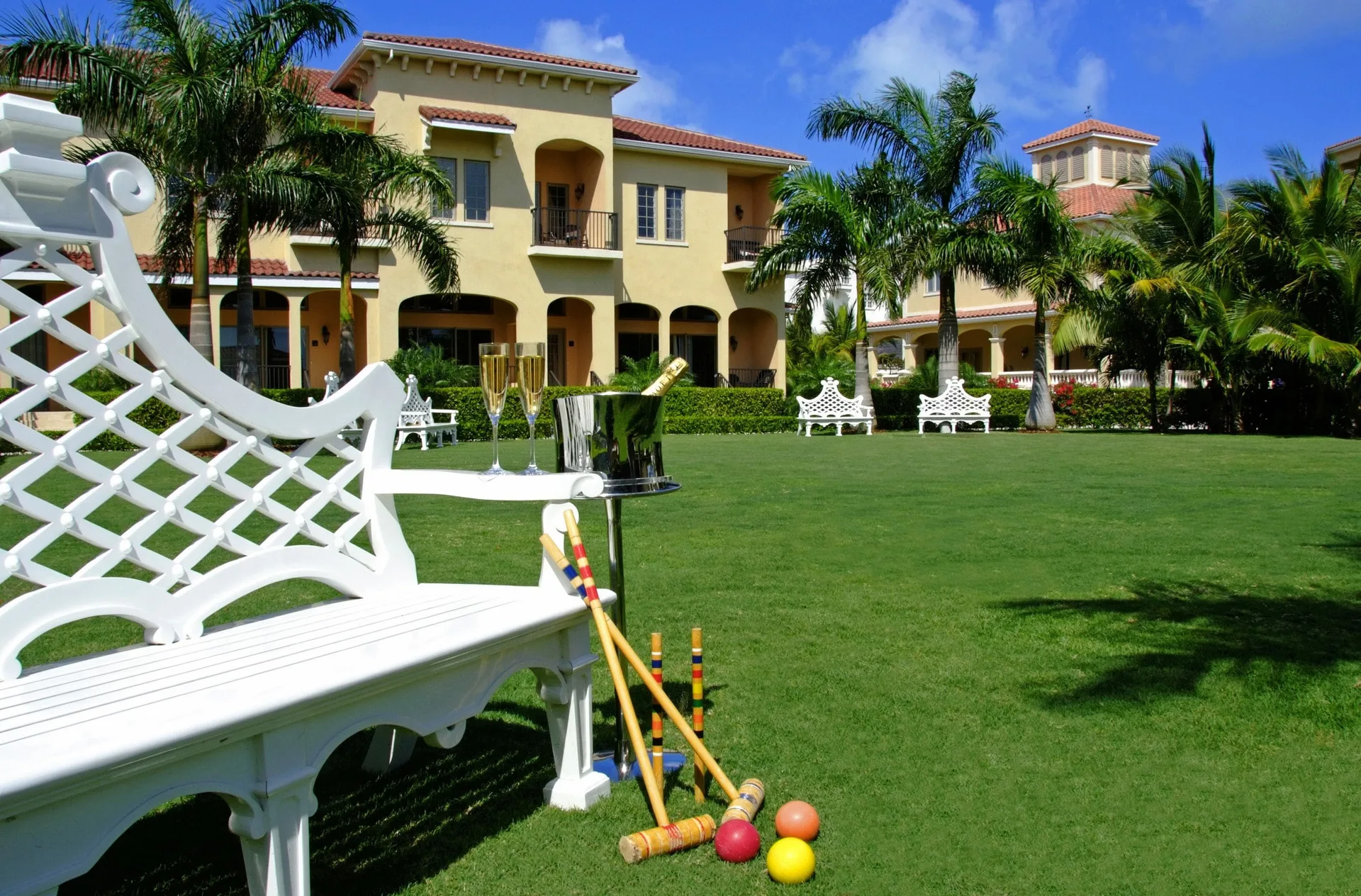 Croquet set, champagne, lawn and resort buildings at The Somerset on Grace Bay.