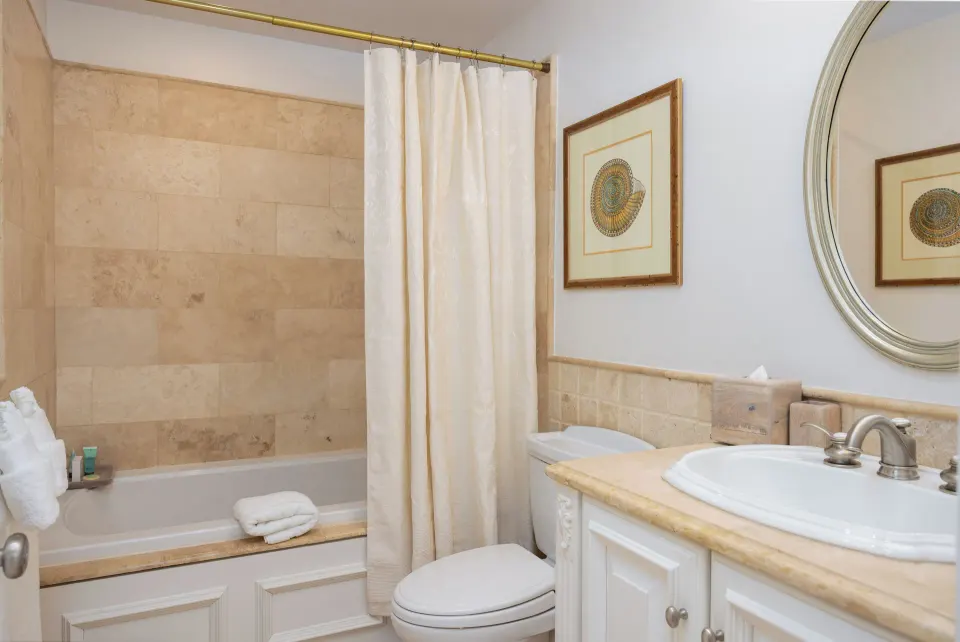 1 Bedroom Residence bathroom with tub and vanity at The Somerset on Grace Bay.