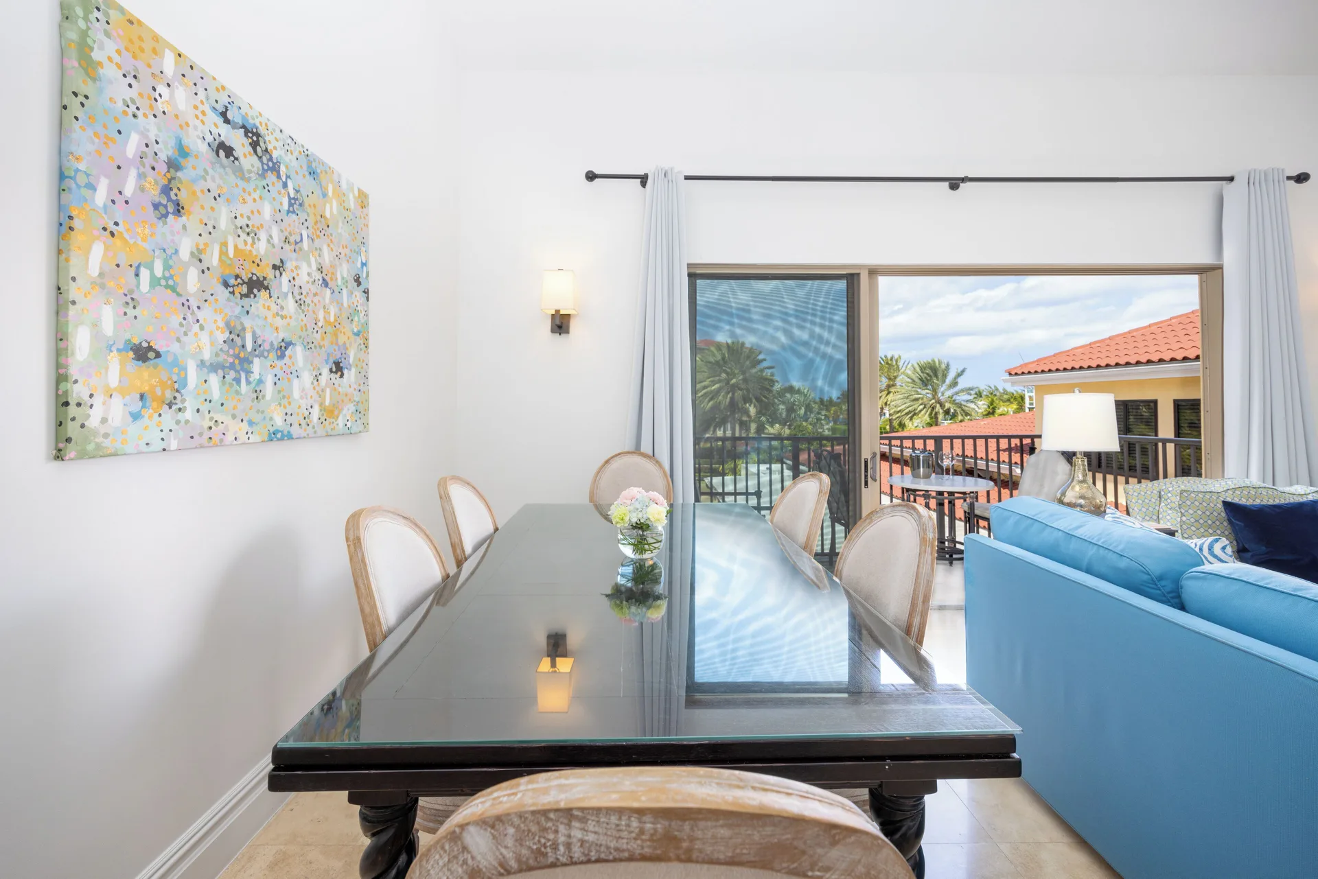 1 Bedroom Residence dining area and balcony doors at The Somerset on Grace Bay.