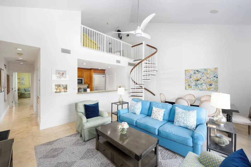 1 Bedroom Residence living area with loft stair at The Somerset on Grace Bay.