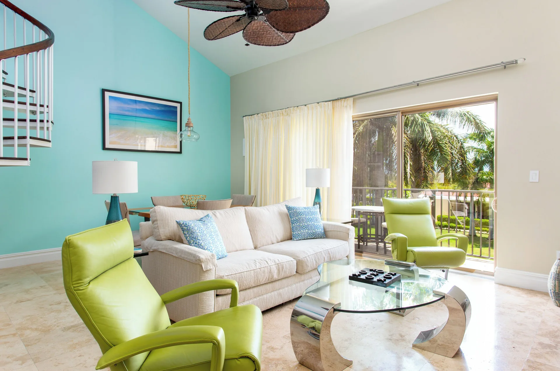 1 Bedroom Residence living room with sofa and balcony at The Somerset on Grace Bay.