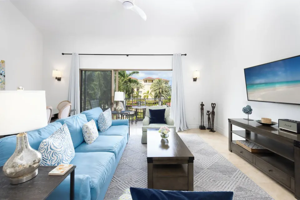 1 Bedroom Residence sitting area with blue sofa at The Somerset on Grace Bay.