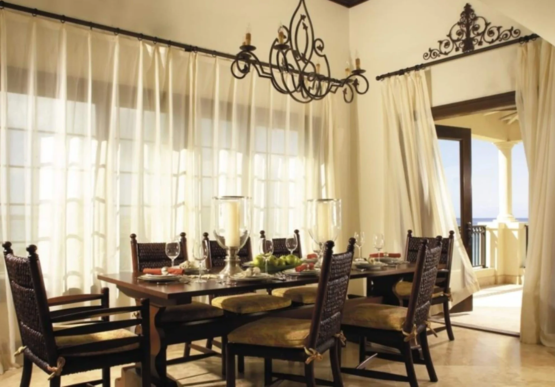 Formal dining area with balcony access in the penthouse at The Somerset on Grace Bay.