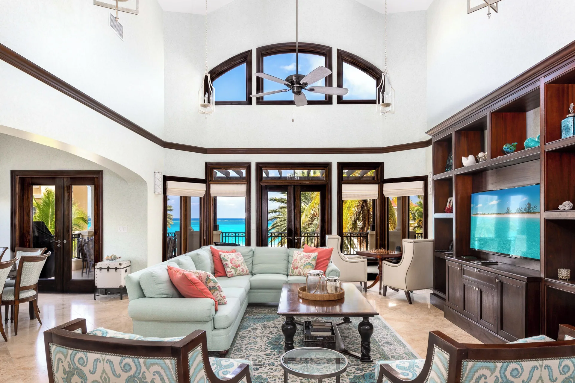 Penthouse living room with ocean-facing windows at The Somerset on Grace Bay.