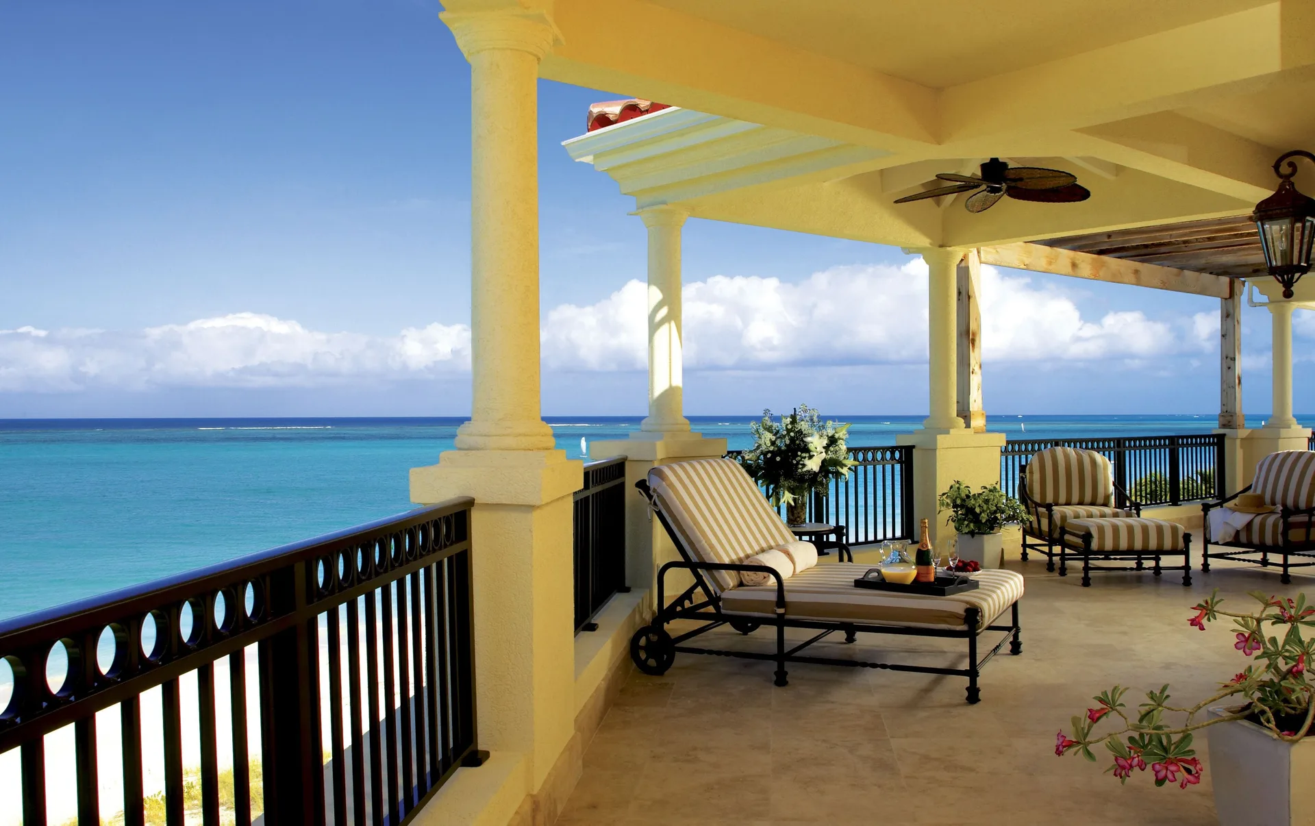 Oceanfront penthouse terrace with lounge seating at The Somerset on Grace Bay.